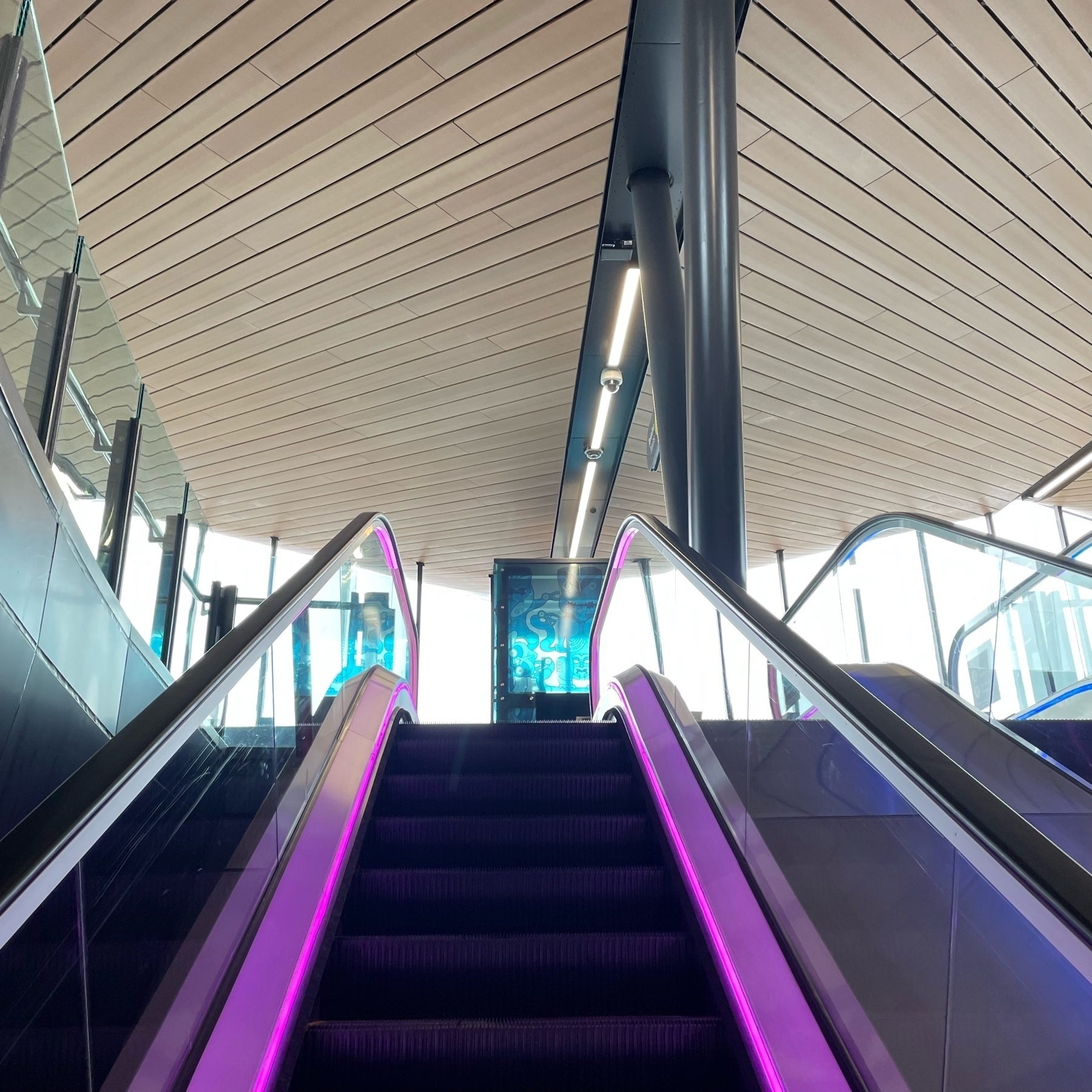 Purple lights on escalator 