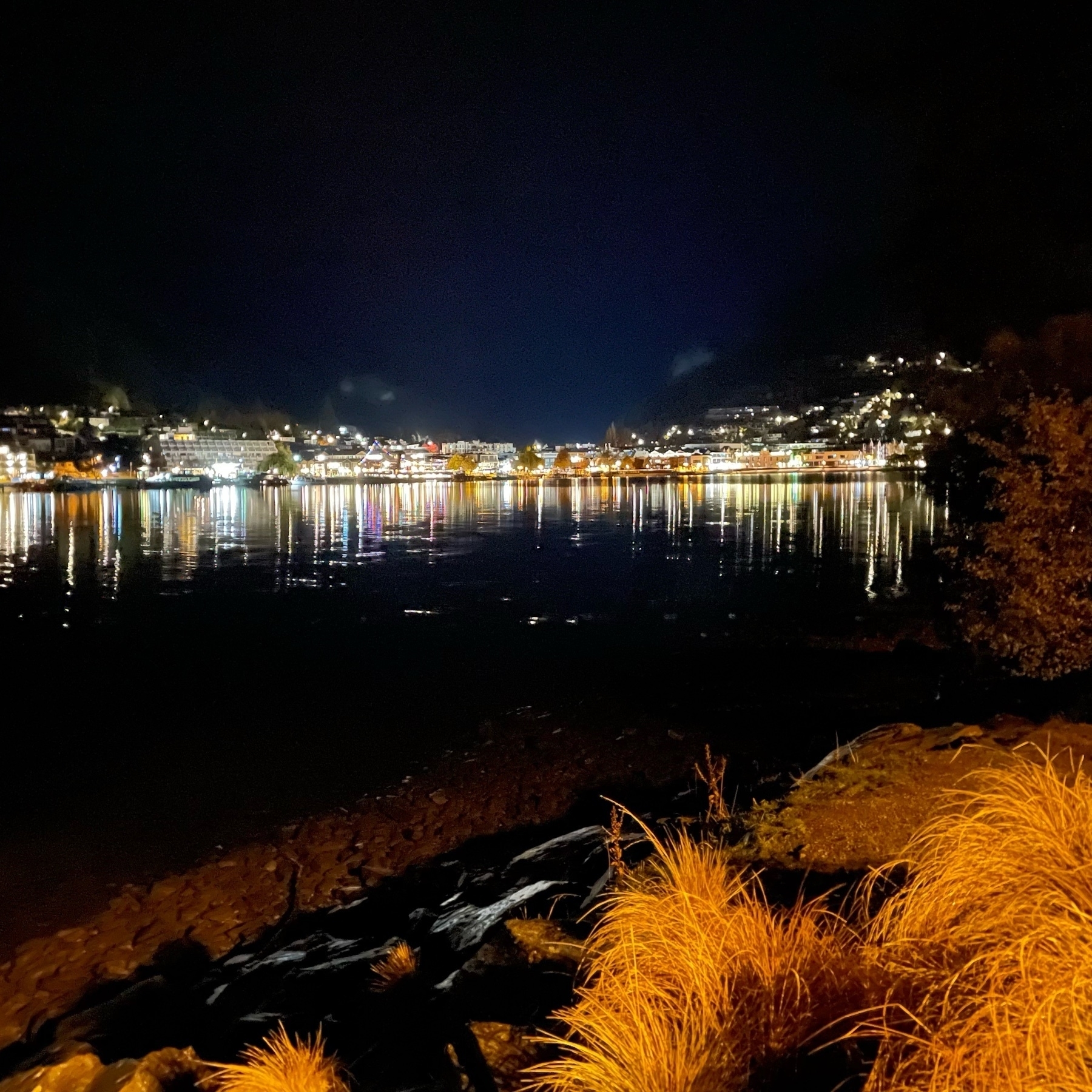view of Queenstown inner harbour in early morning darkness 