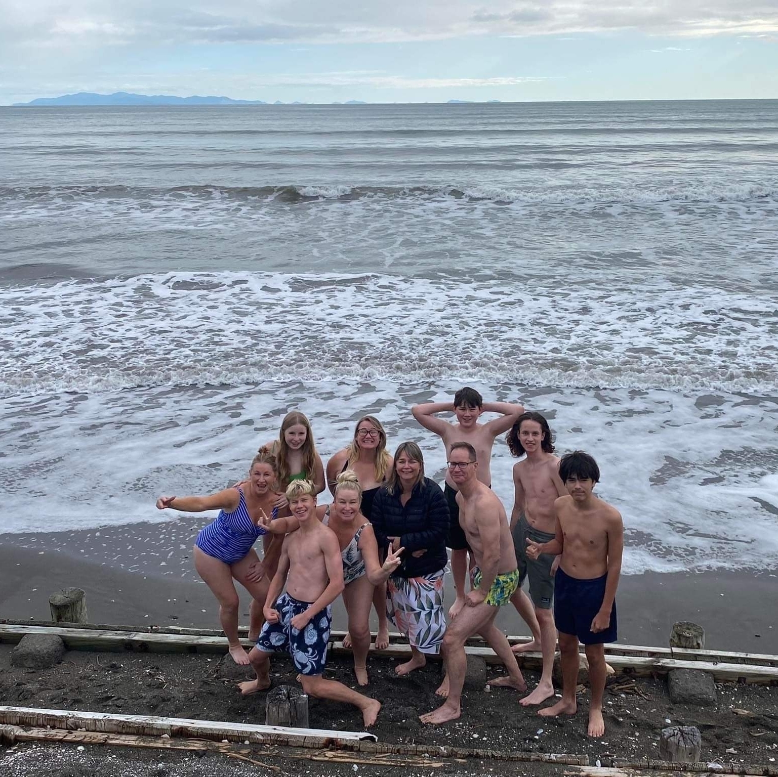 Group of mad people preparing to swim in the cold sea