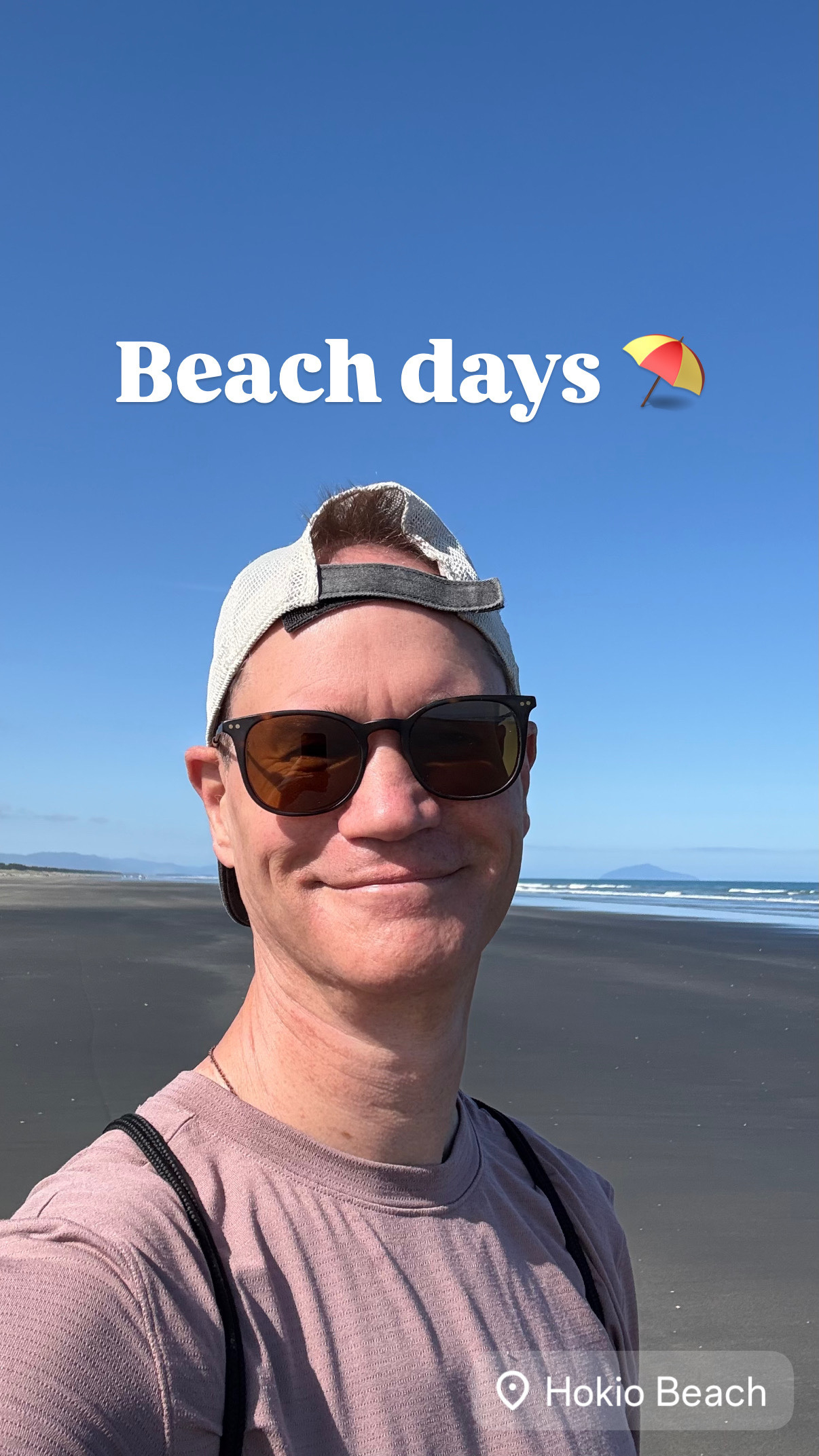 Jeremy at Hokio beach wearing a reverse cap. 