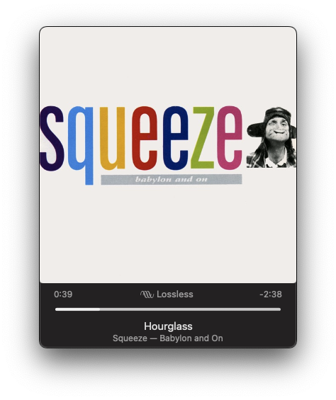 A music player interface displays the song Hourglass by Squeeze, from the album Babylon and On, accompanied by a stylized album cover featuring colorful letters and a small black and white image of a monkey dressed in a suit.