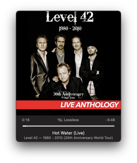 A group photo of five men in suits is featured on an album cover labeled Level 42 1980 - 2010 30th Anniversary World Tour Live Anthology, including a specific track time and title Hot Water (Live).