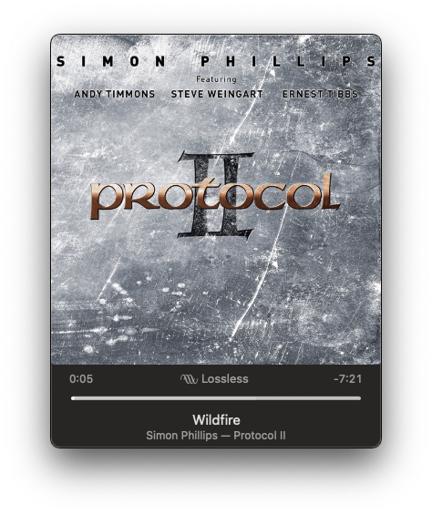 Cover art for the album Protocol II by Simon Phillips, featuring Andy Timmons, Steve Weingart, and Ernest Tibbs, set against a textured metallic background with a music player bar showing the song Wildfire.