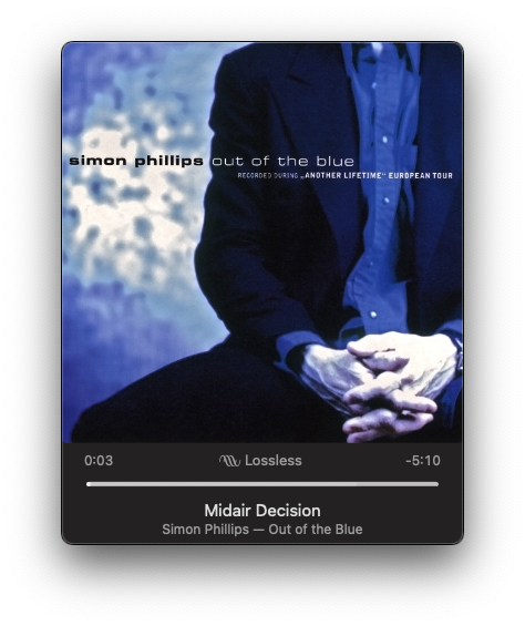 An album cover for Simon Phillips' Out of the Blue is displayed over a music player showing the track Midair Decision.