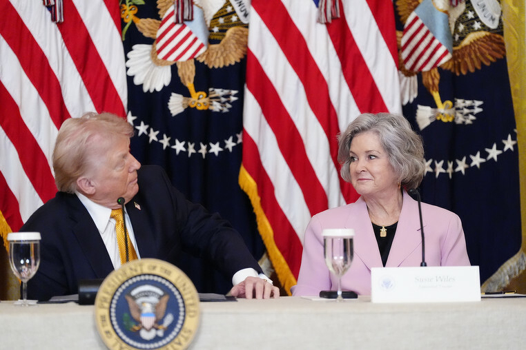 Trump Derangement Syndrome in the flesh (Donald J. Trump, Left) and Chief of Staff Susie Wiles (Right) at a propaganda seeding event held at a Kennedy Center board meeting where little was discussed about the actual Kennedy Center. 