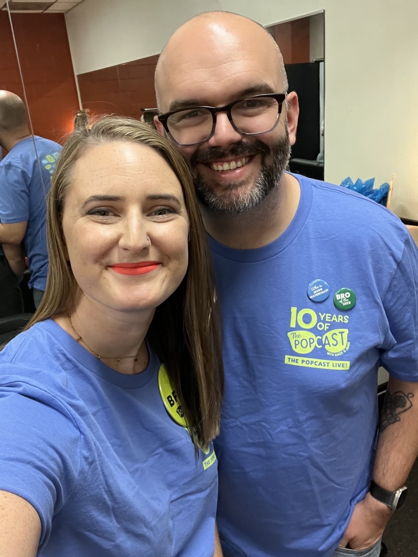 My wife and I in our volunteer shirts for The Popcast Live