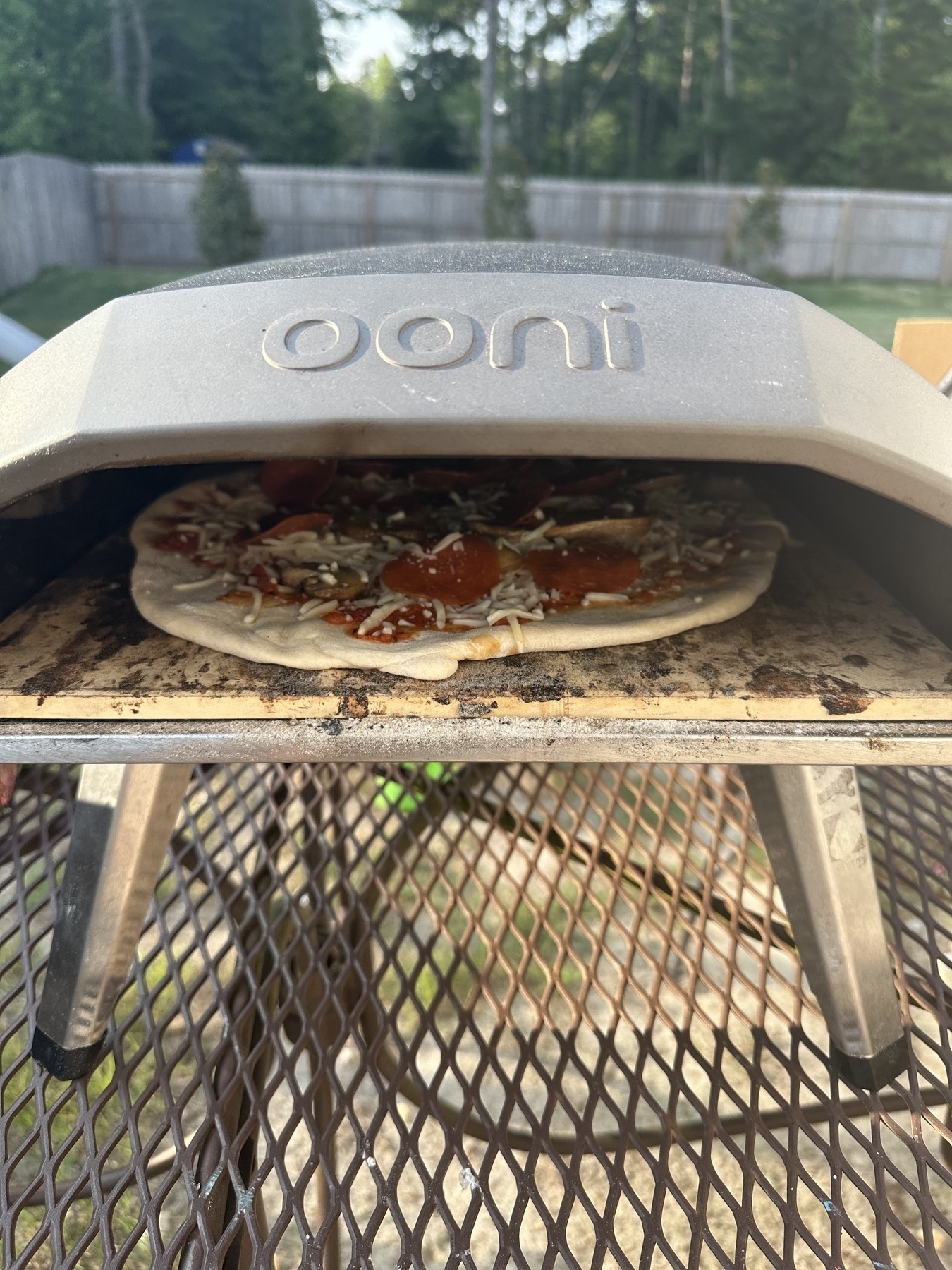 Pizza cooking in an Ooni Pizza Oven