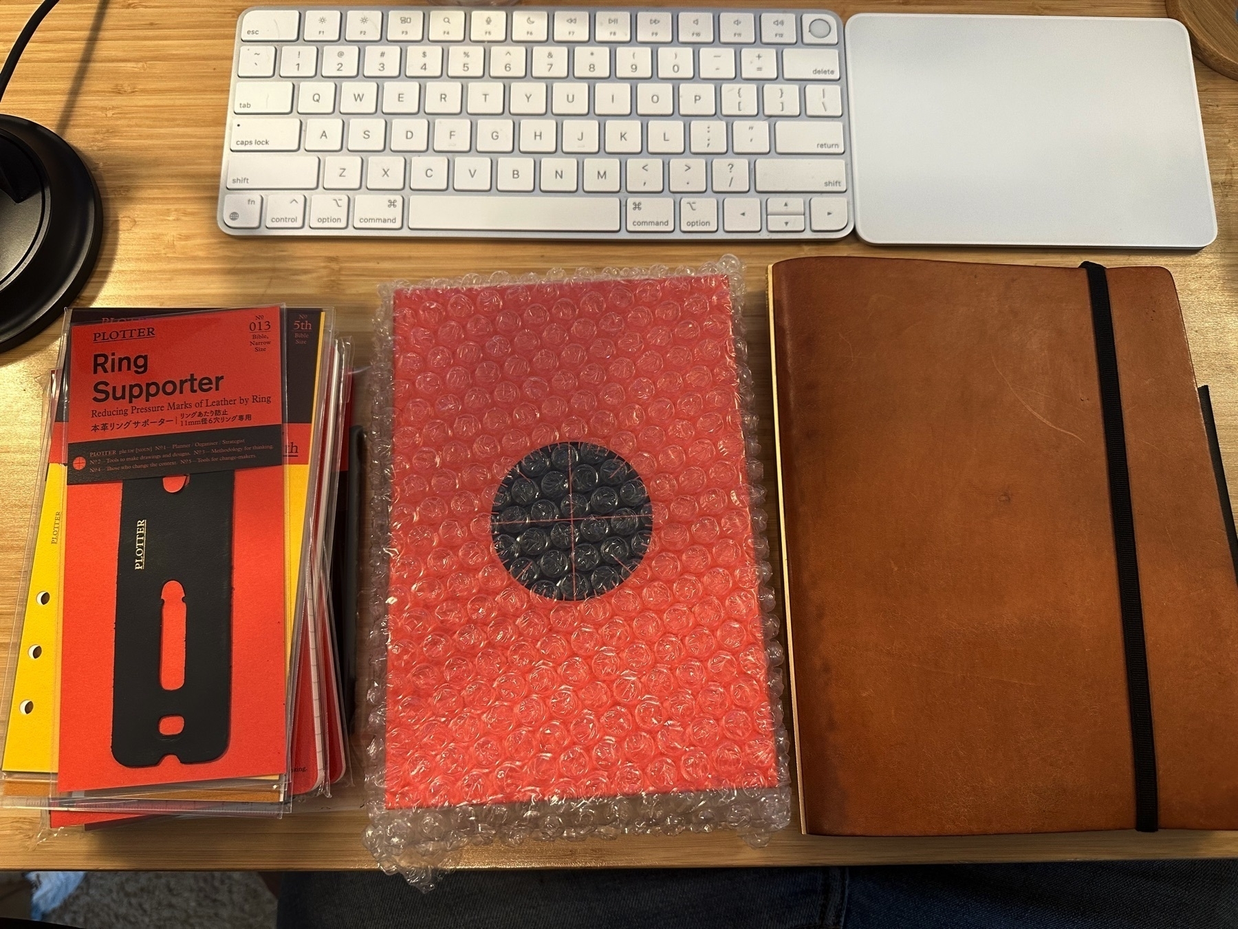 Plotter notebook supplies, a new, unopened plotter notebook, and my current A5 sized Plotter.