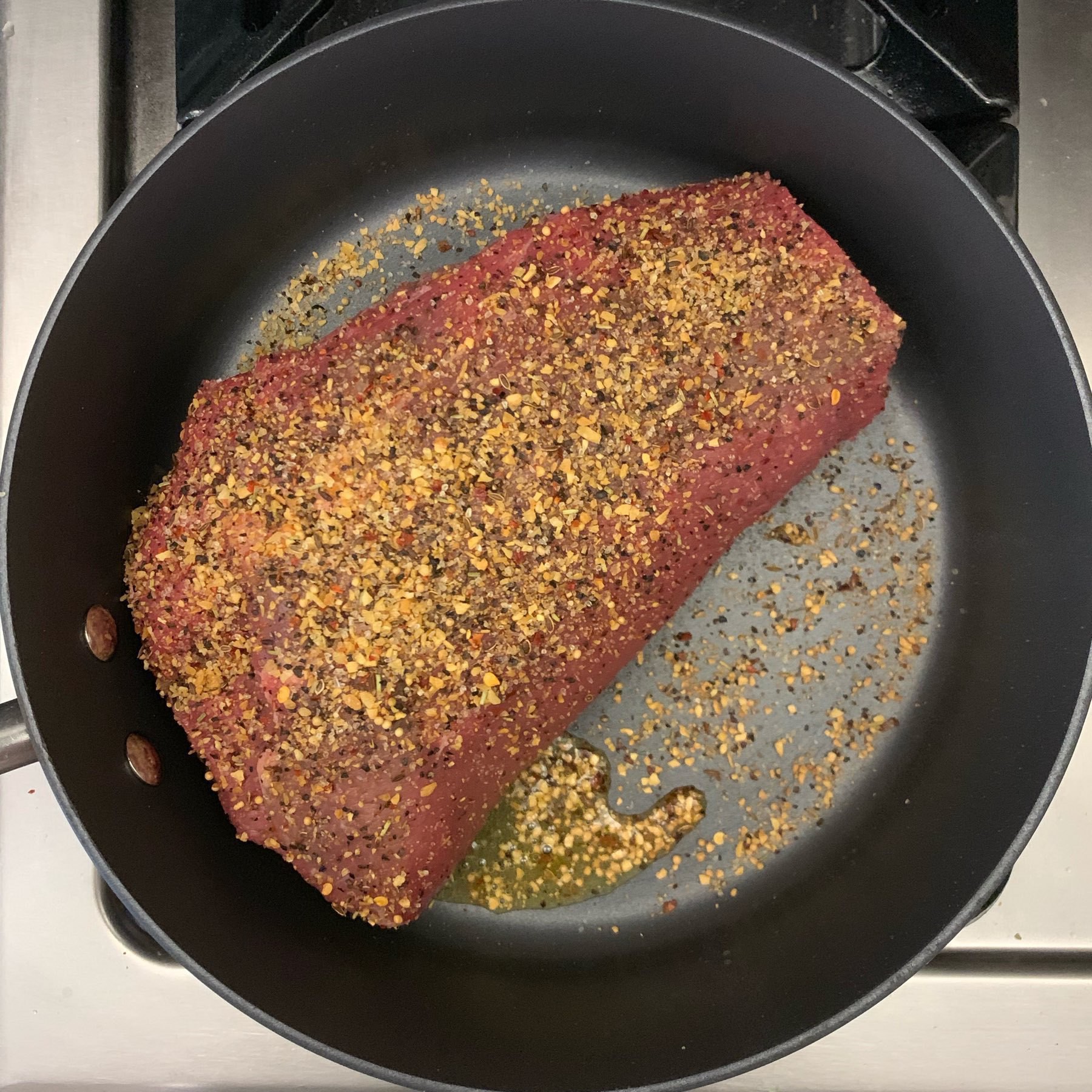 Beef chuck roast in a skillet 