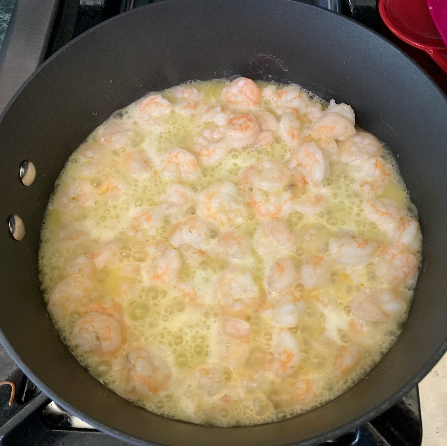 Shrimp cooking in a butter bath