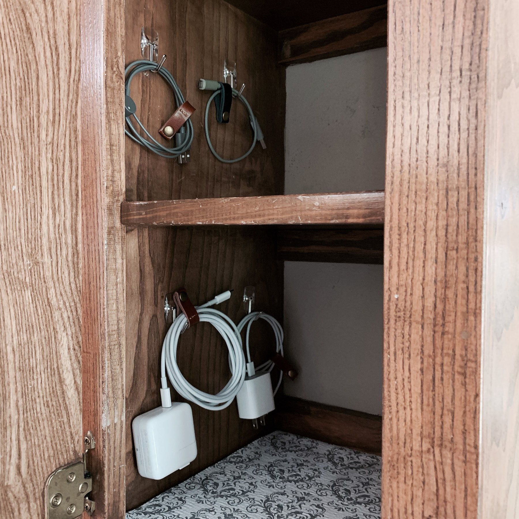 Cables neatly hung in a cabinet
