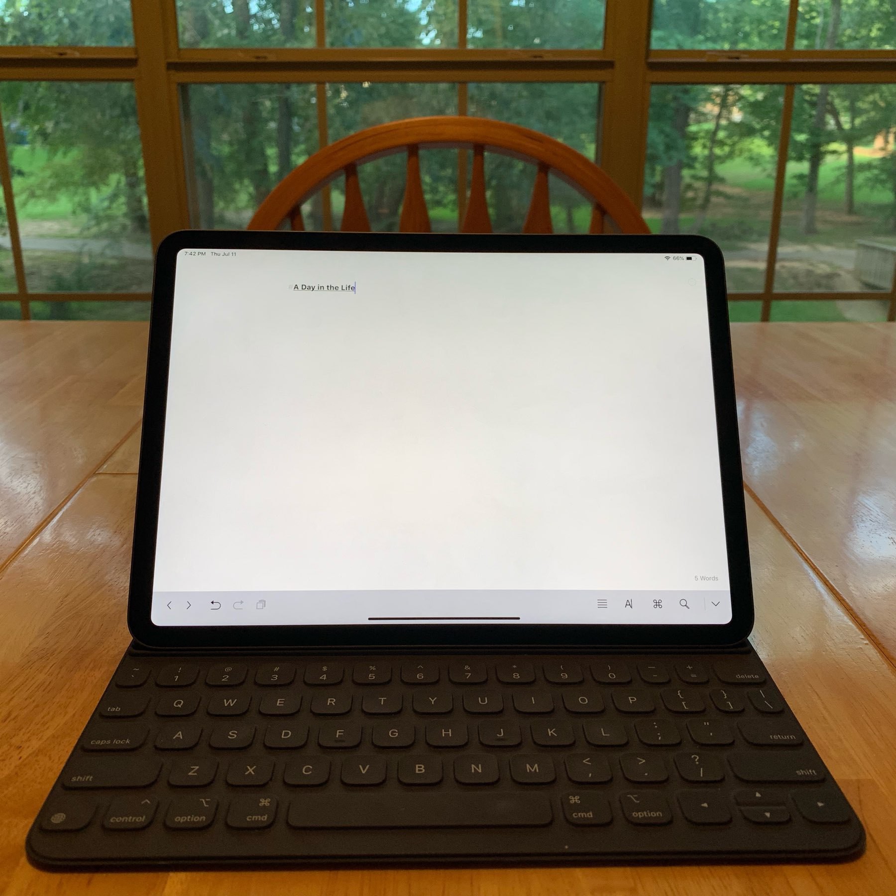 iPad on table with blank sheet open in Ulysses app