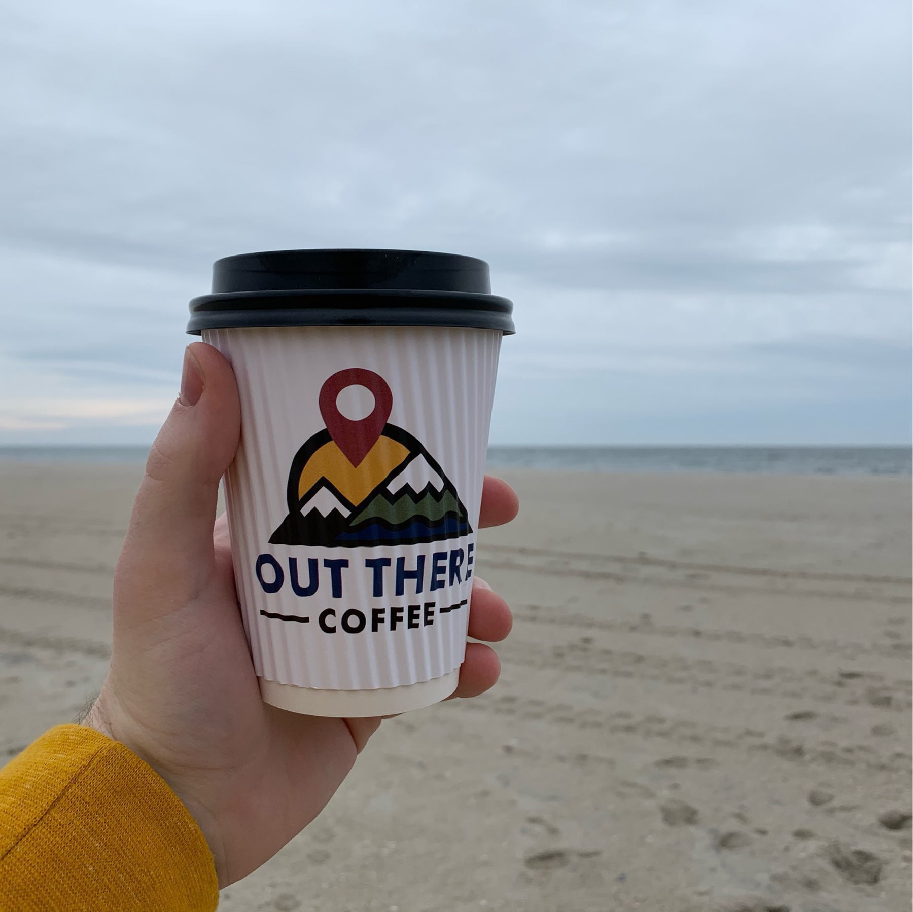 Coffee cup in foreground, Atlantic Ocean in the background.