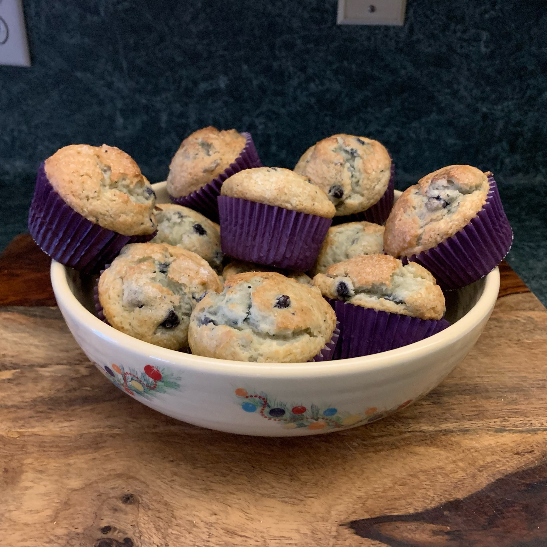 Bowl of freshly baked blueberry muffins. 