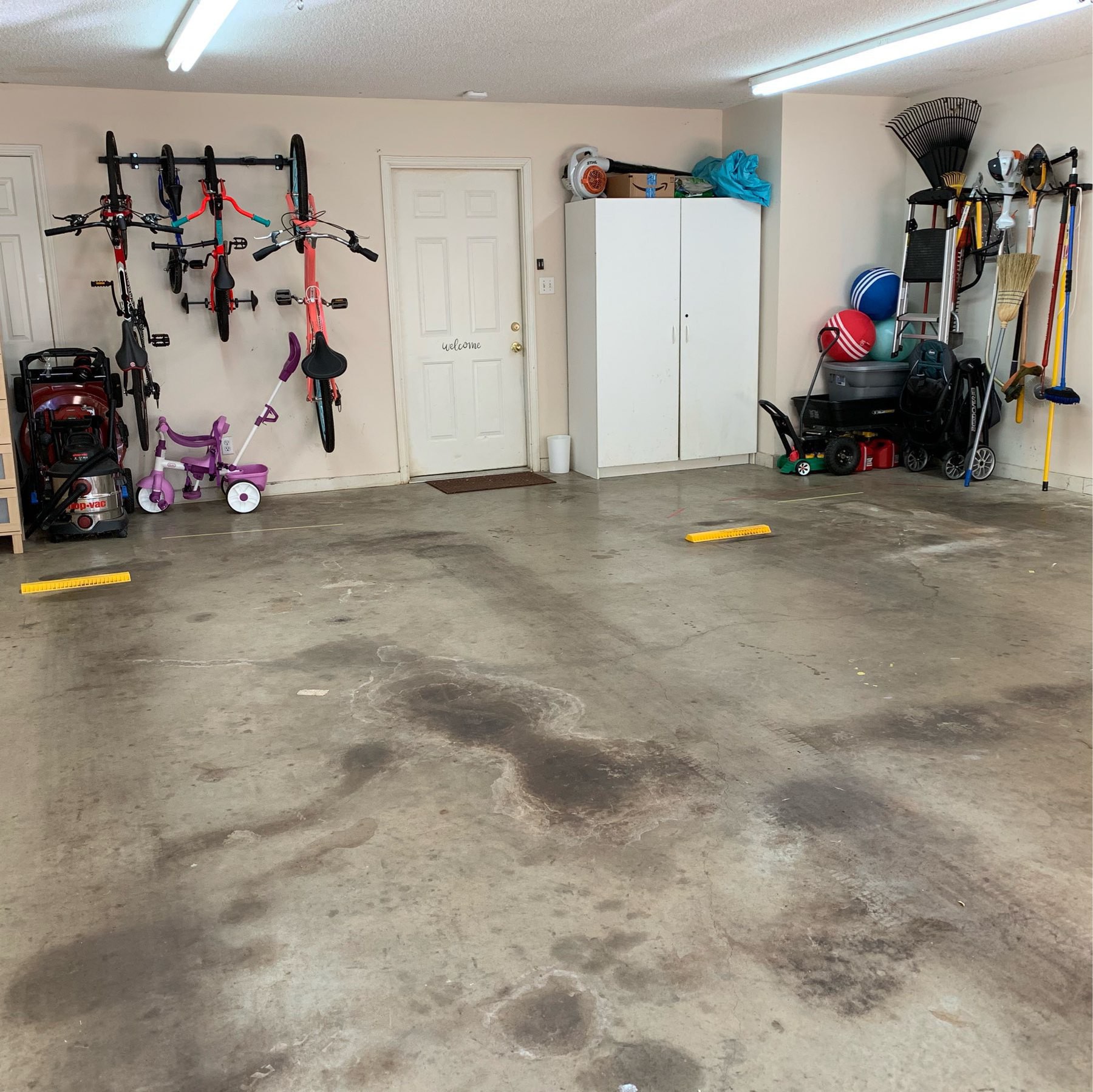 Tidy garage with lots of wall storage