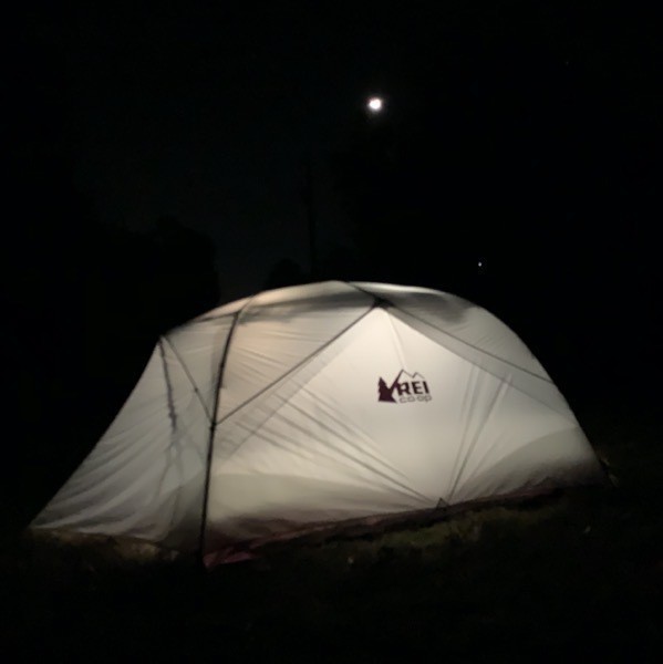 Tent illuminated under the moon