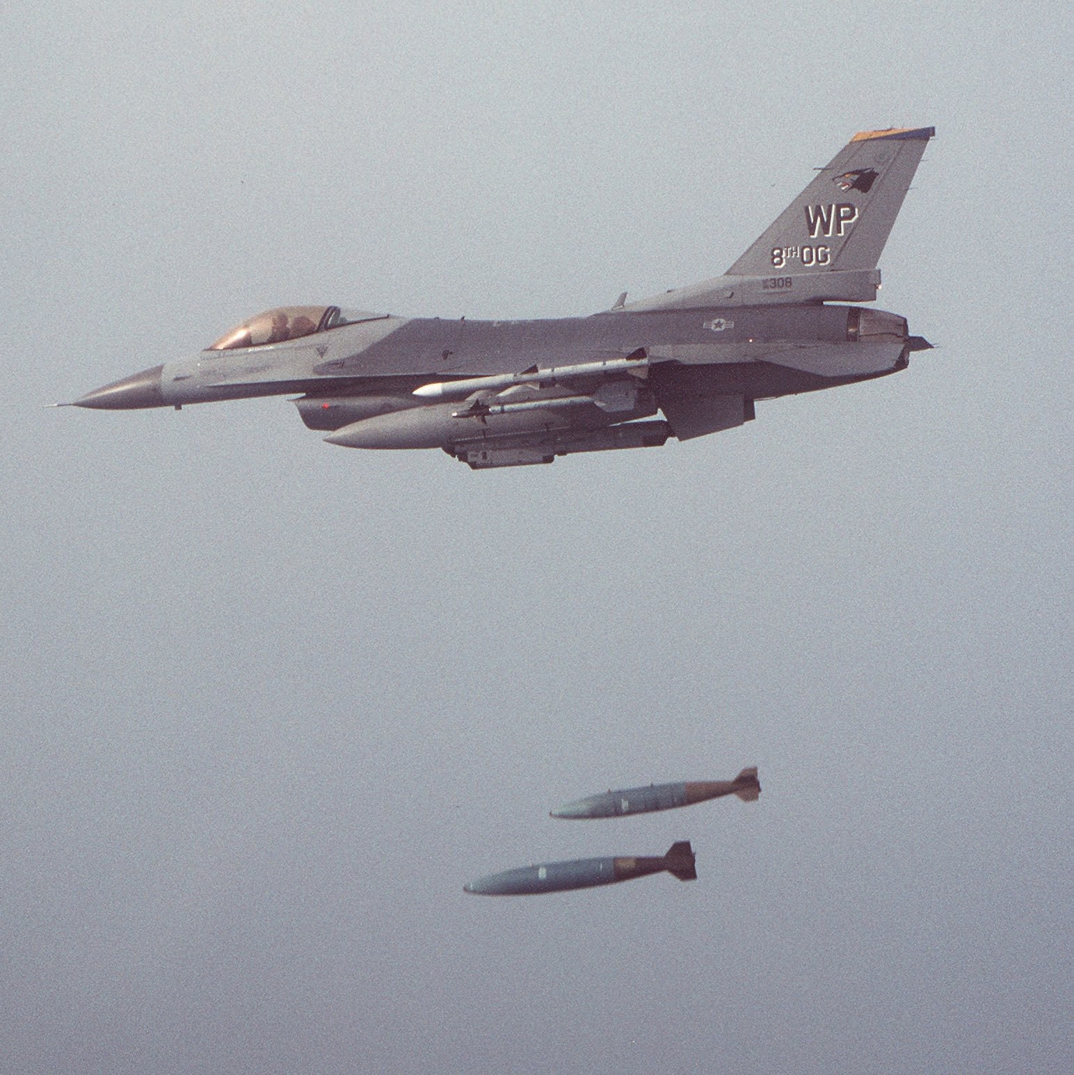 F-16 dropping a pair of bombs.