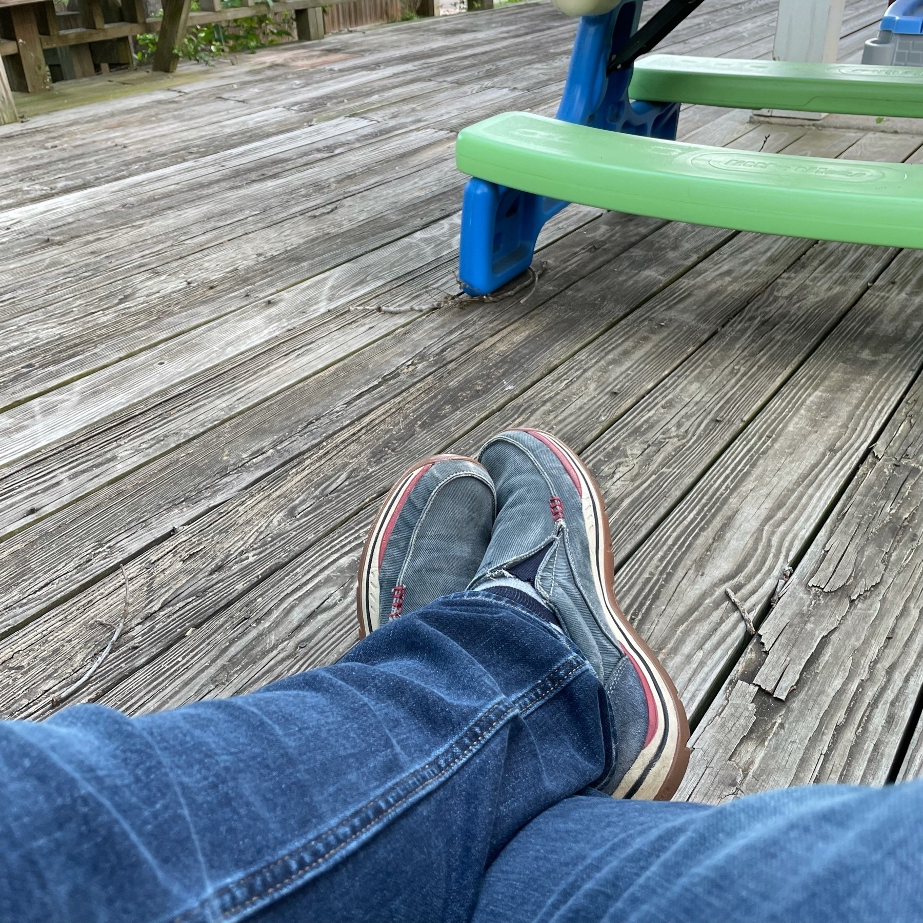 Feet on a deck