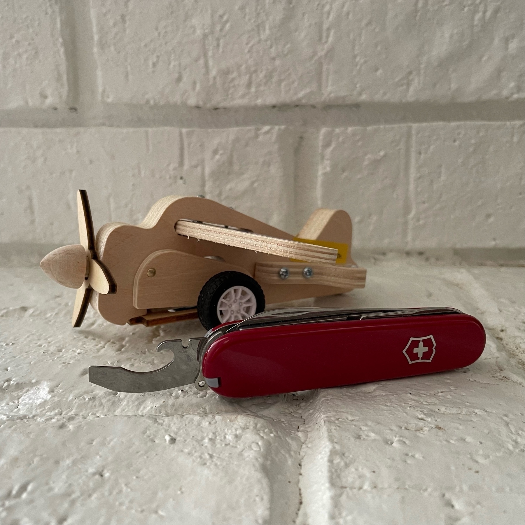 Wooden airplane and Swiss Army Knife