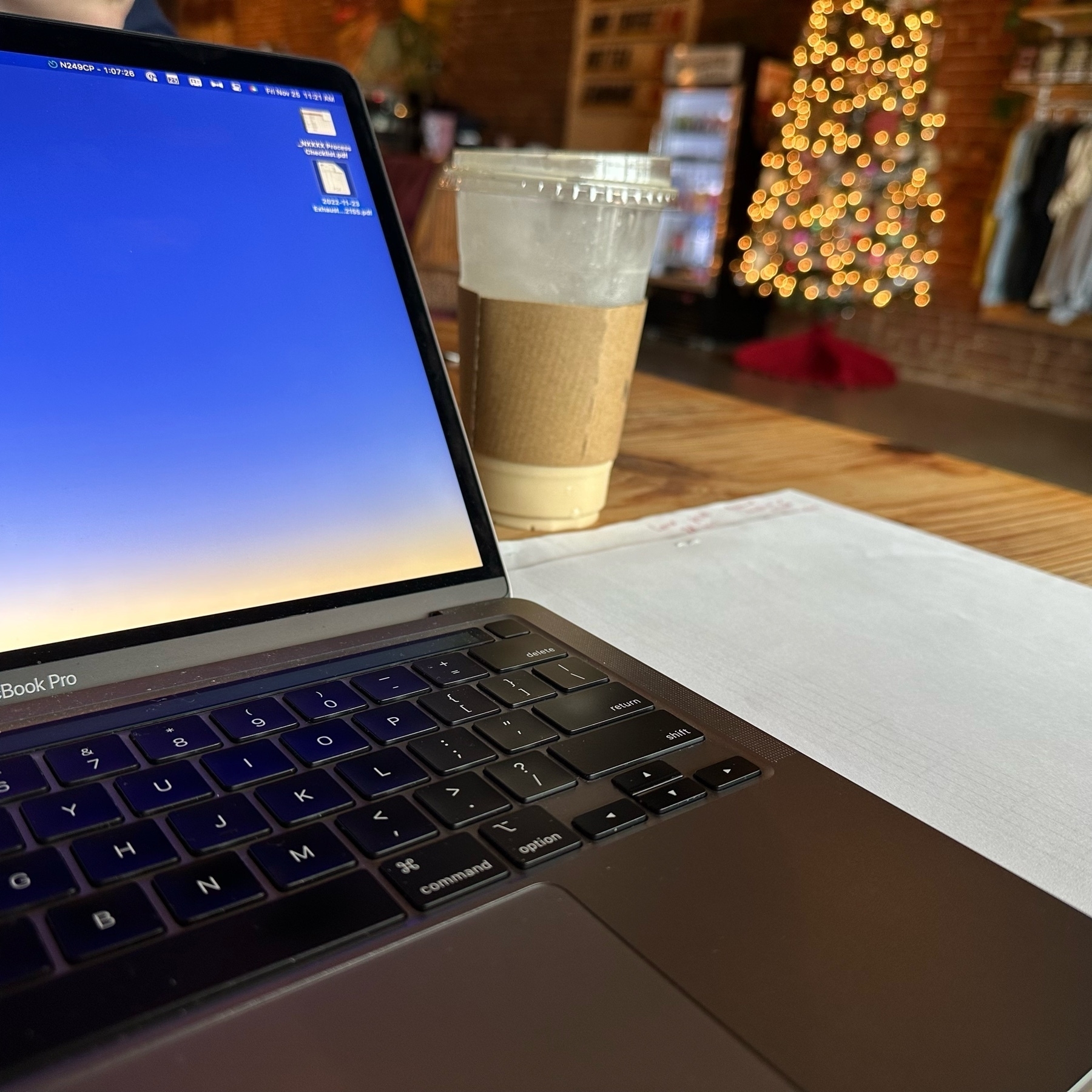 Laptop, coffee, Christmas tree. 