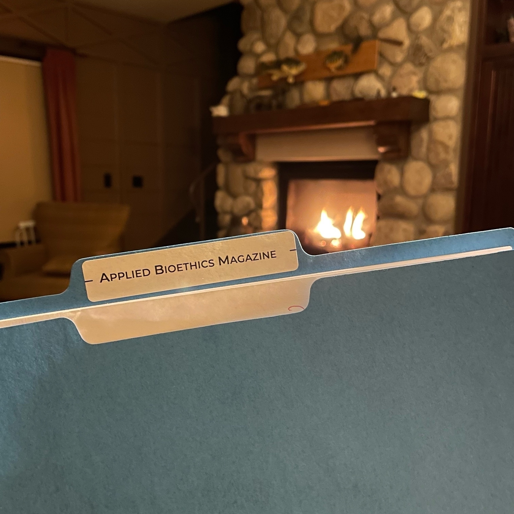 File folder in front of fire. 
