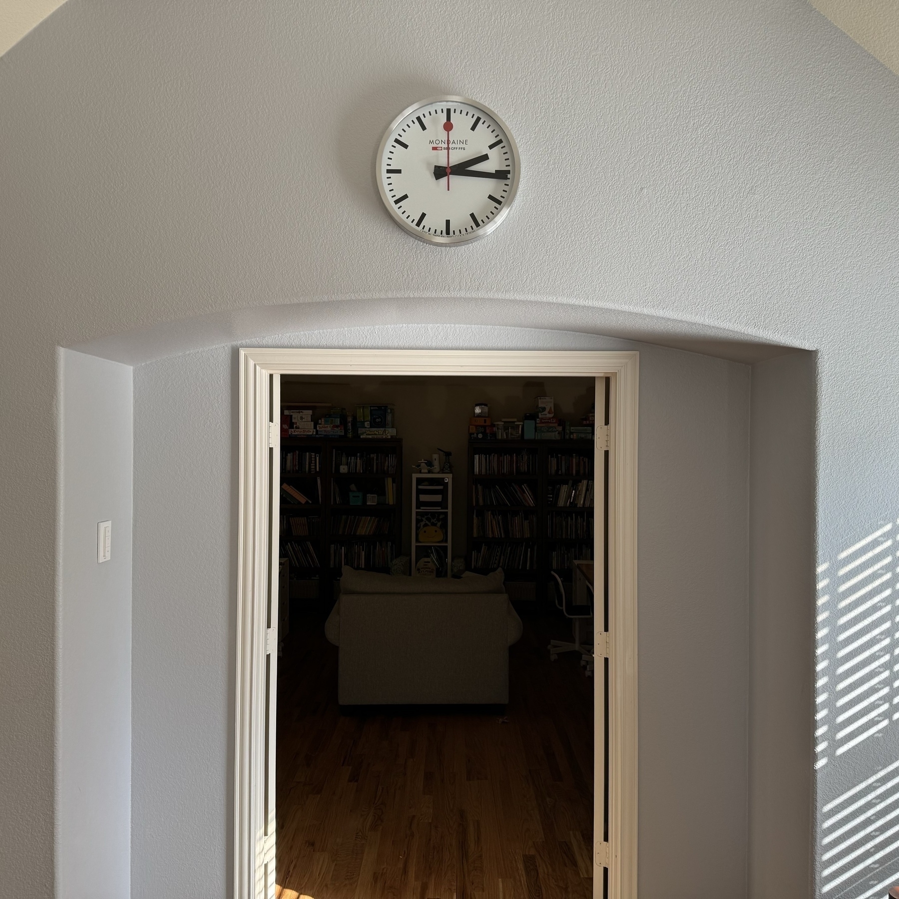Swiss clock over library door