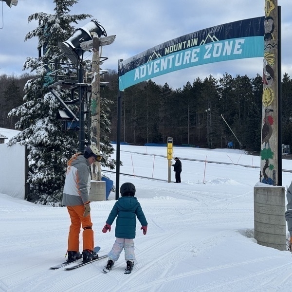 Child and ski instructor