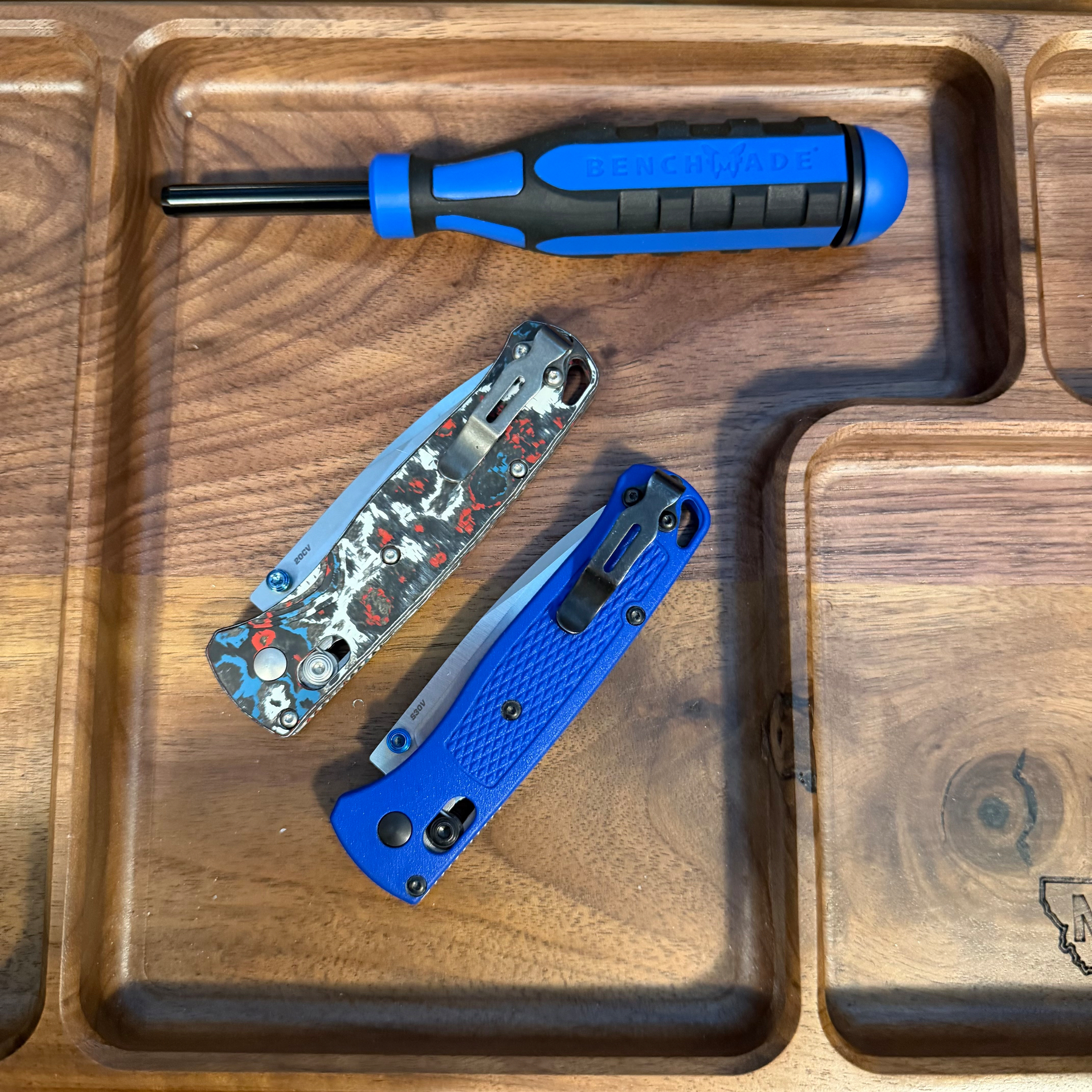 Benchmade Bugouts in a work tray