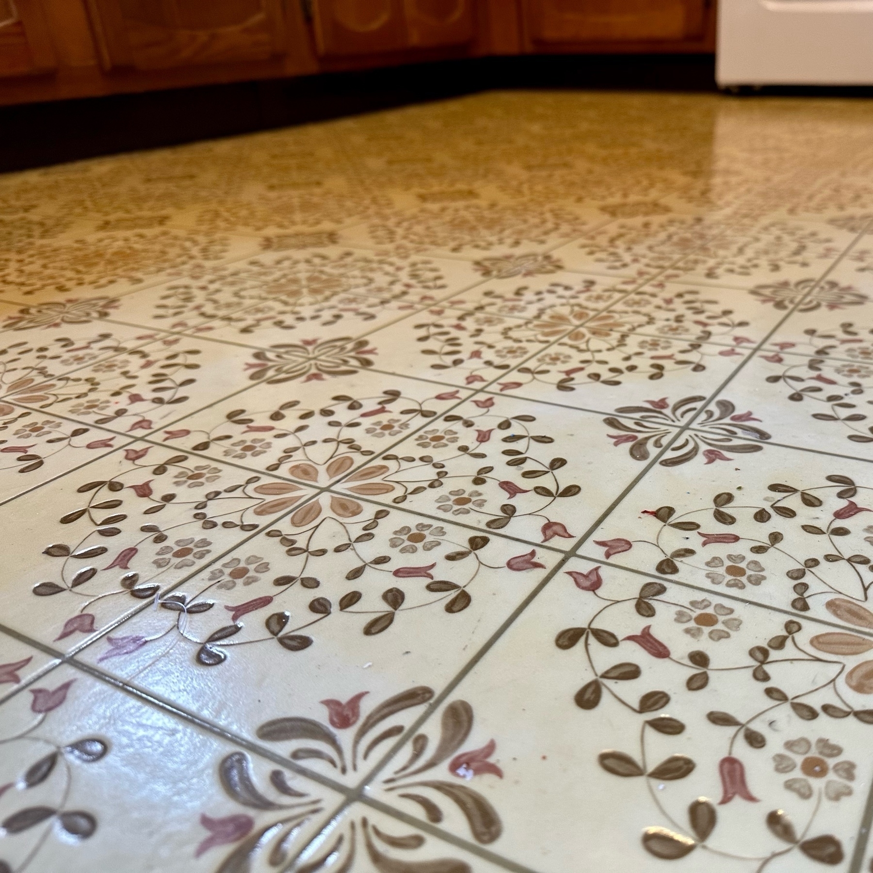 Photograph of laminate flooring with floral pattern in kitchen