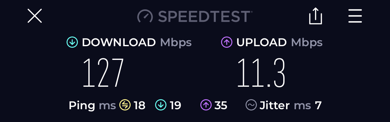 A speedtest showing 127Mbps down and 11.3Mbps up.
