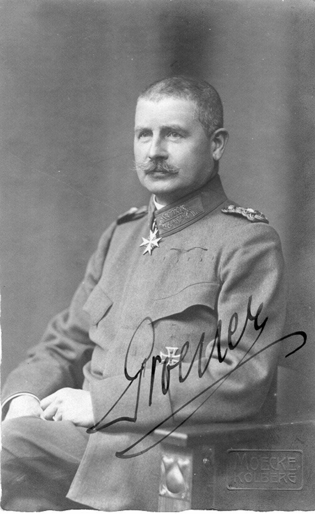 German officer, seated, in a wartime dress uniform