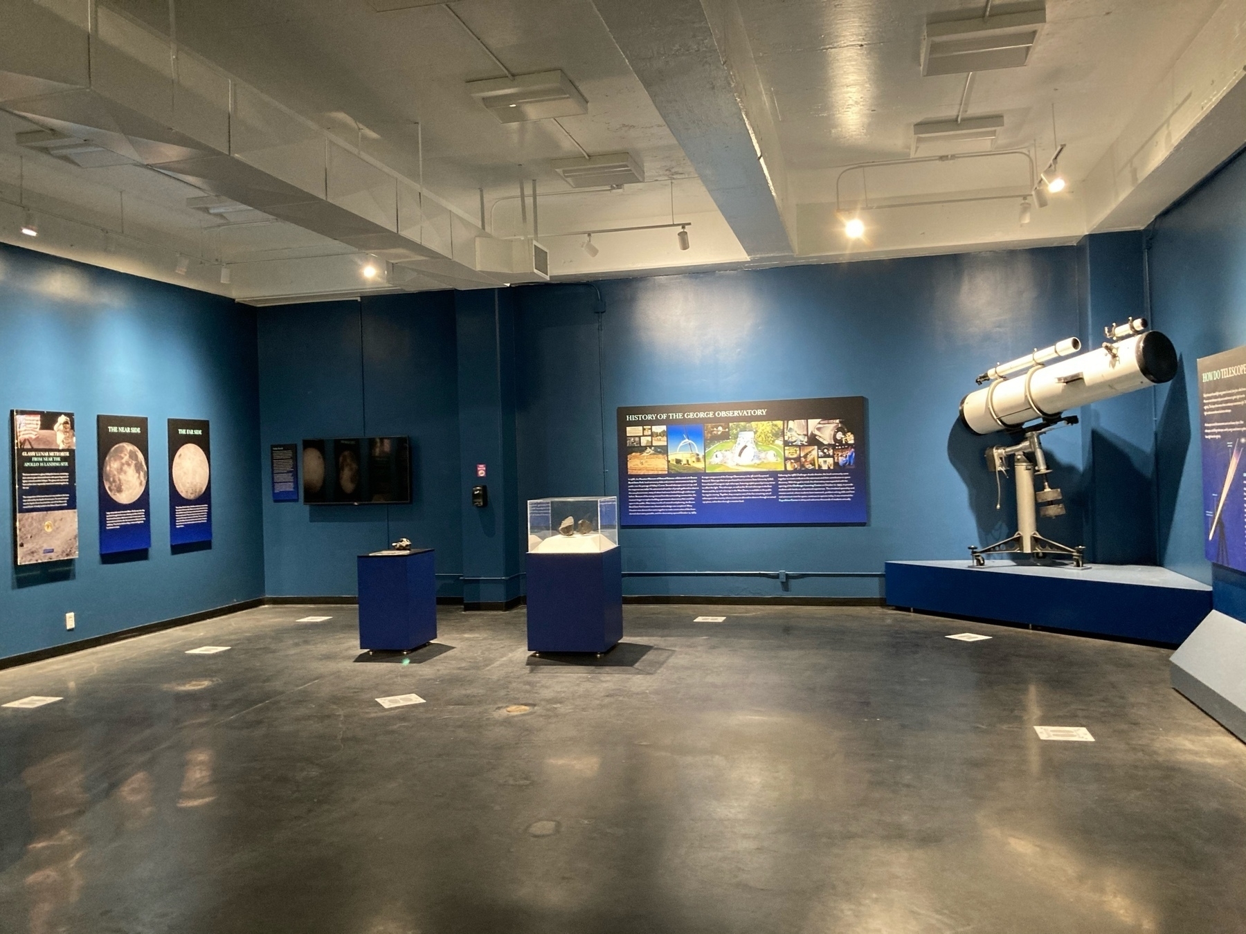 Room with telescopes and items on display