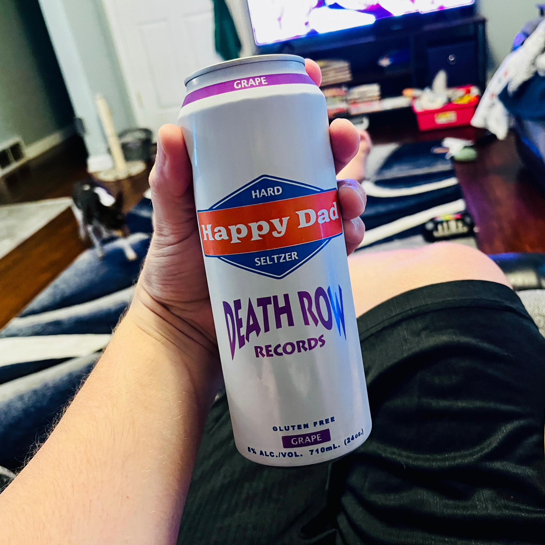 I’m holding a can of Happy Dad hard seltzer. It’s grape flavored and it has a DEATH ROW RECORDS logo under the happy dad logo.