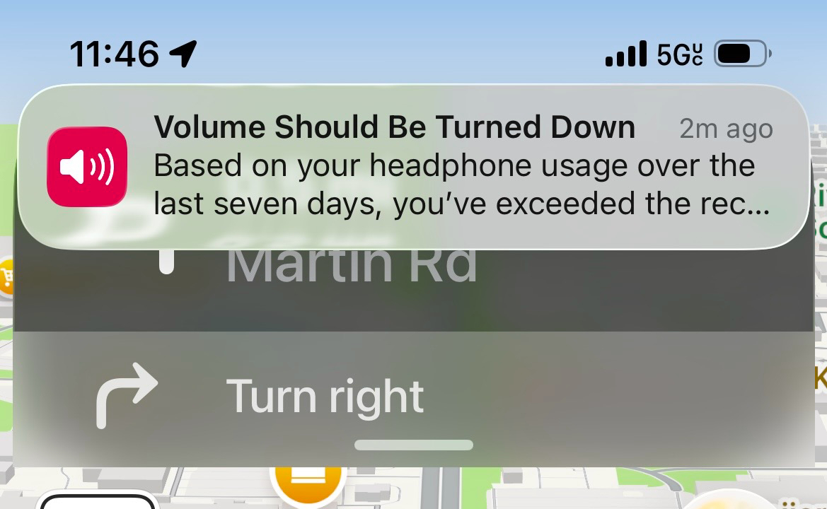 Screenshot of Apple Maps from iOS 26 Public Beta 2: there’s a persistent notification RIGHT ON TOP of the directions at the top of the screen. 