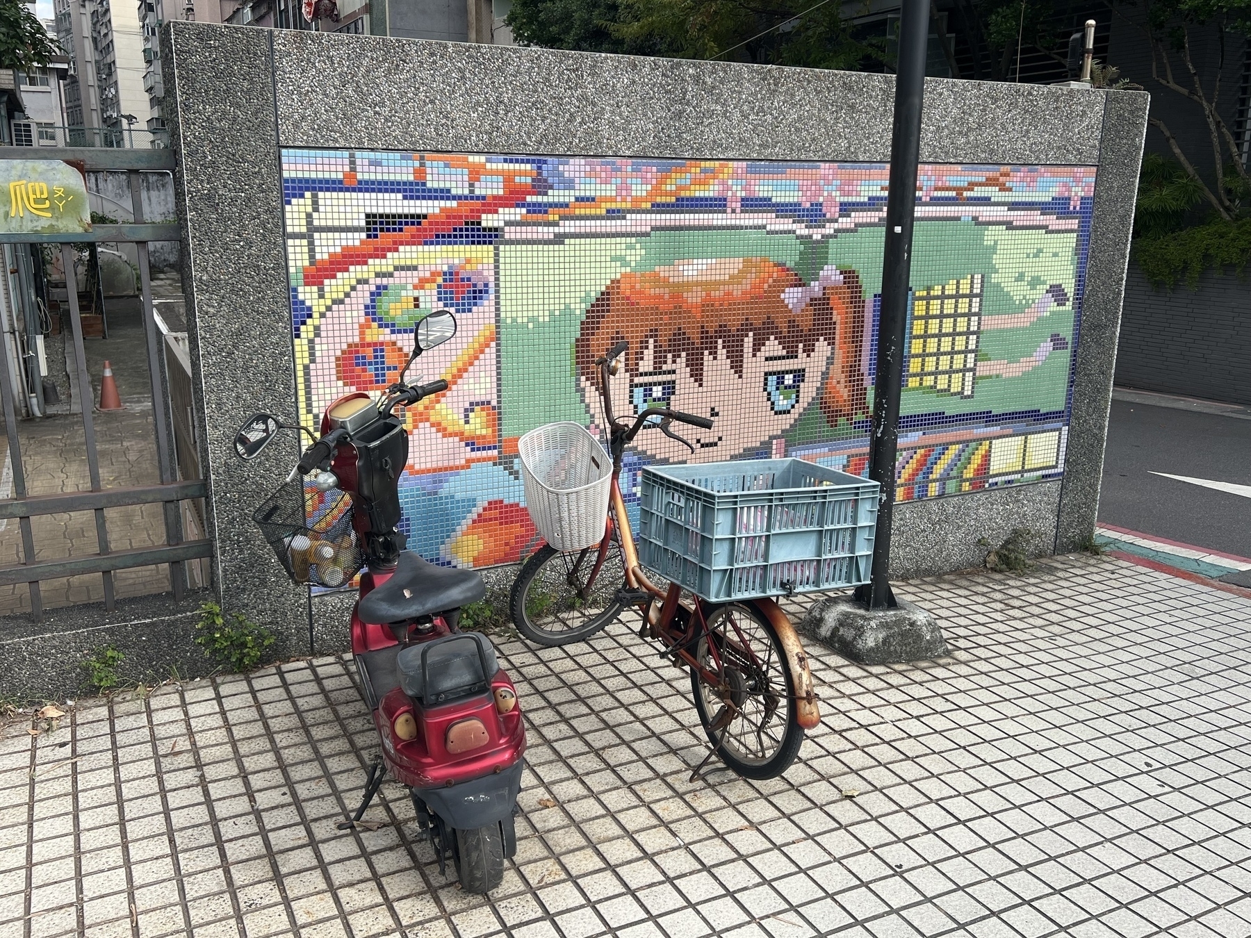 tile mosaic with bicycle and scooter