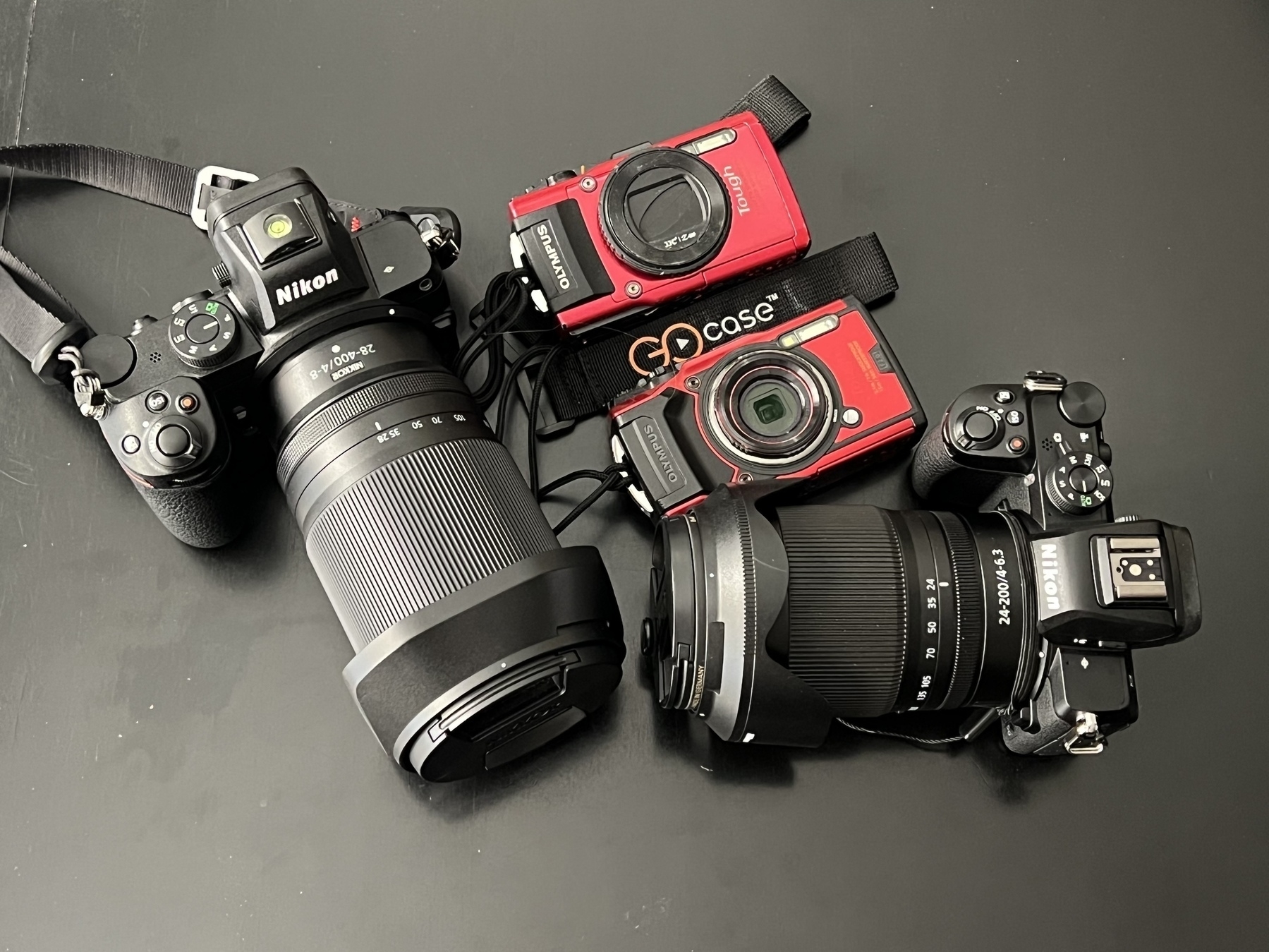 Nikon Z5 and Z50 alongside Olympus Tough TG-4 and TG-6 cameras