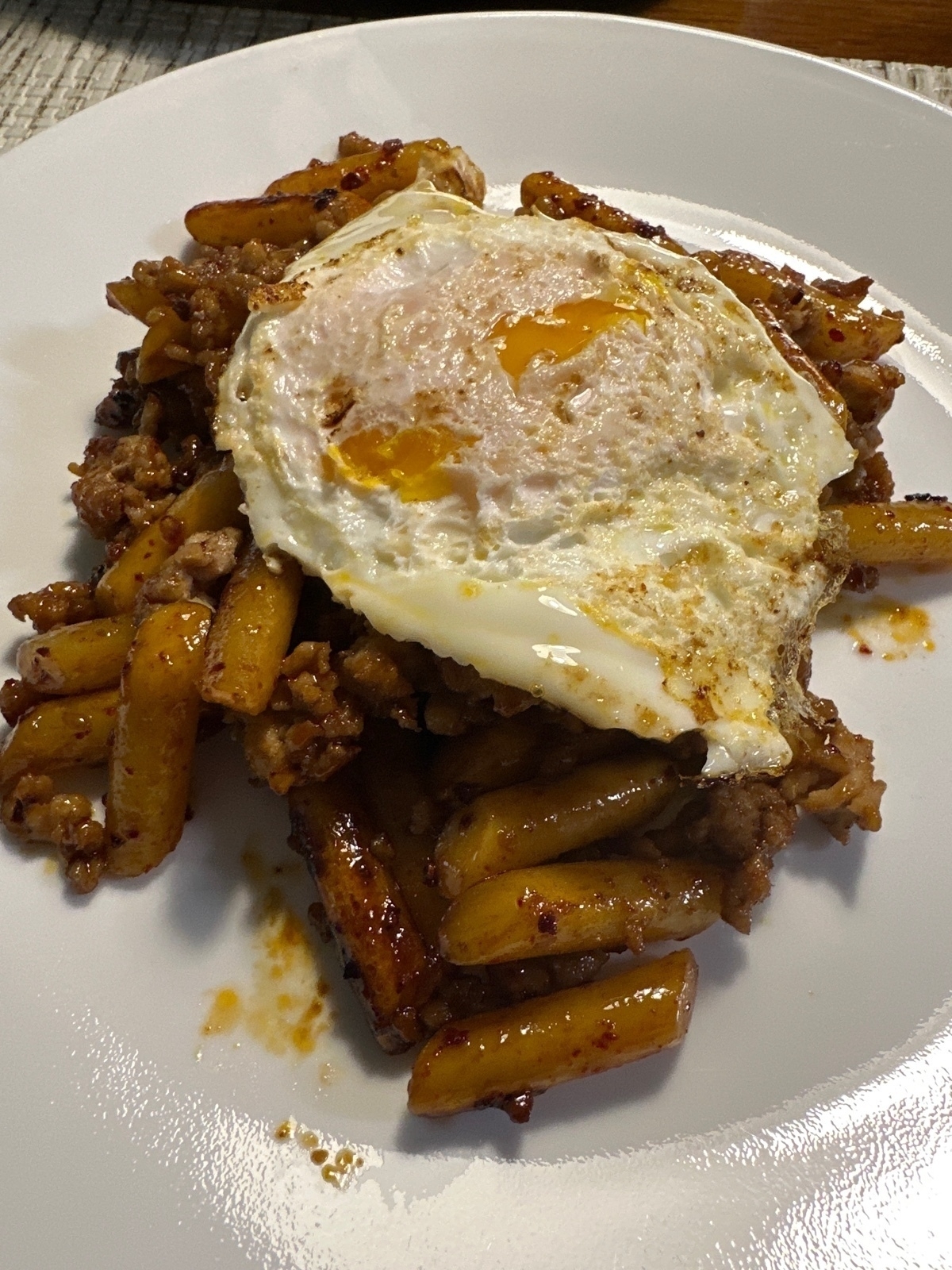 Korean Rice Cakes and ground pork with a fried egg.