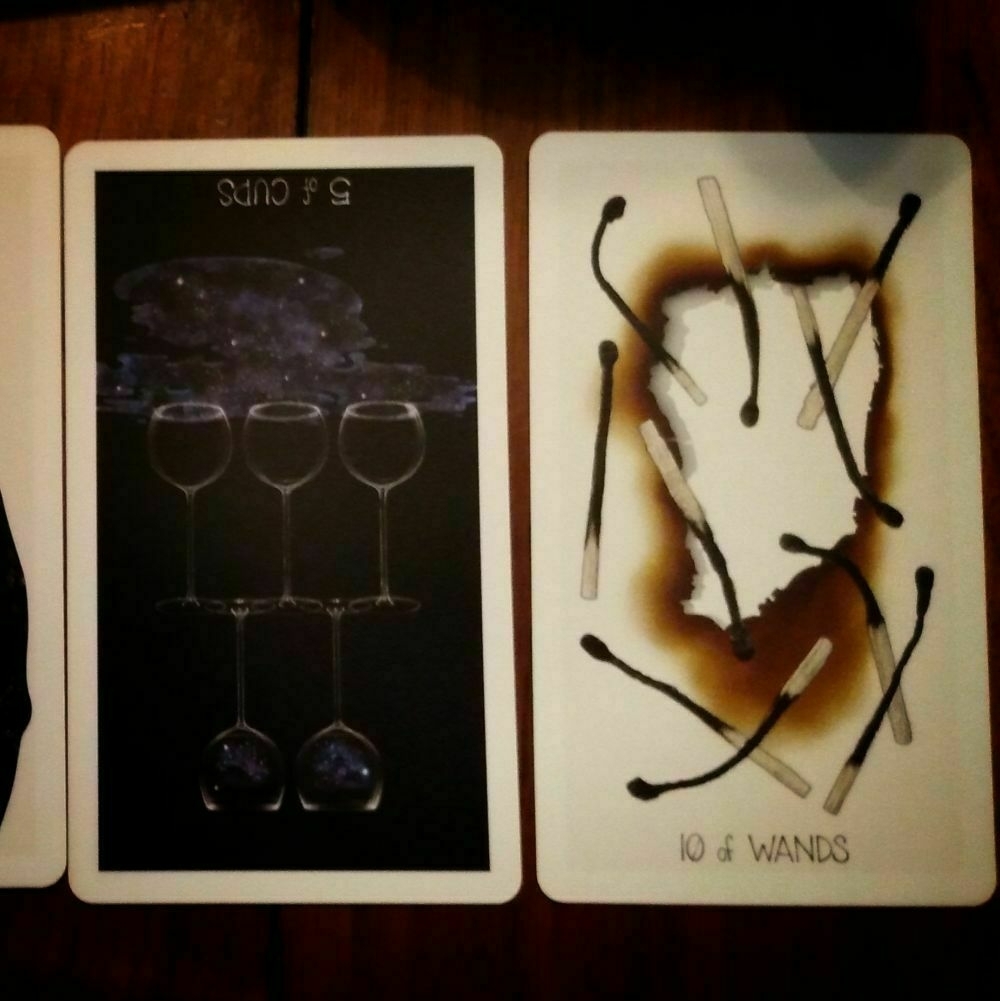 Tarot Cards: 5 of Cups reversed and 10 of Wands