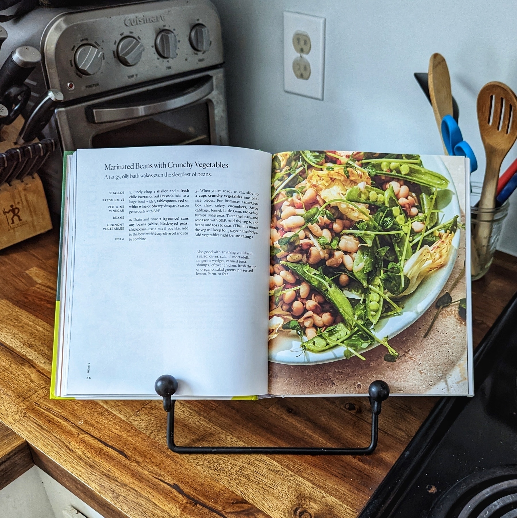 The cookbook I Dream of Dinner So You Don't Have To opened to the page of Marinated Beans with Crunchy Veggies