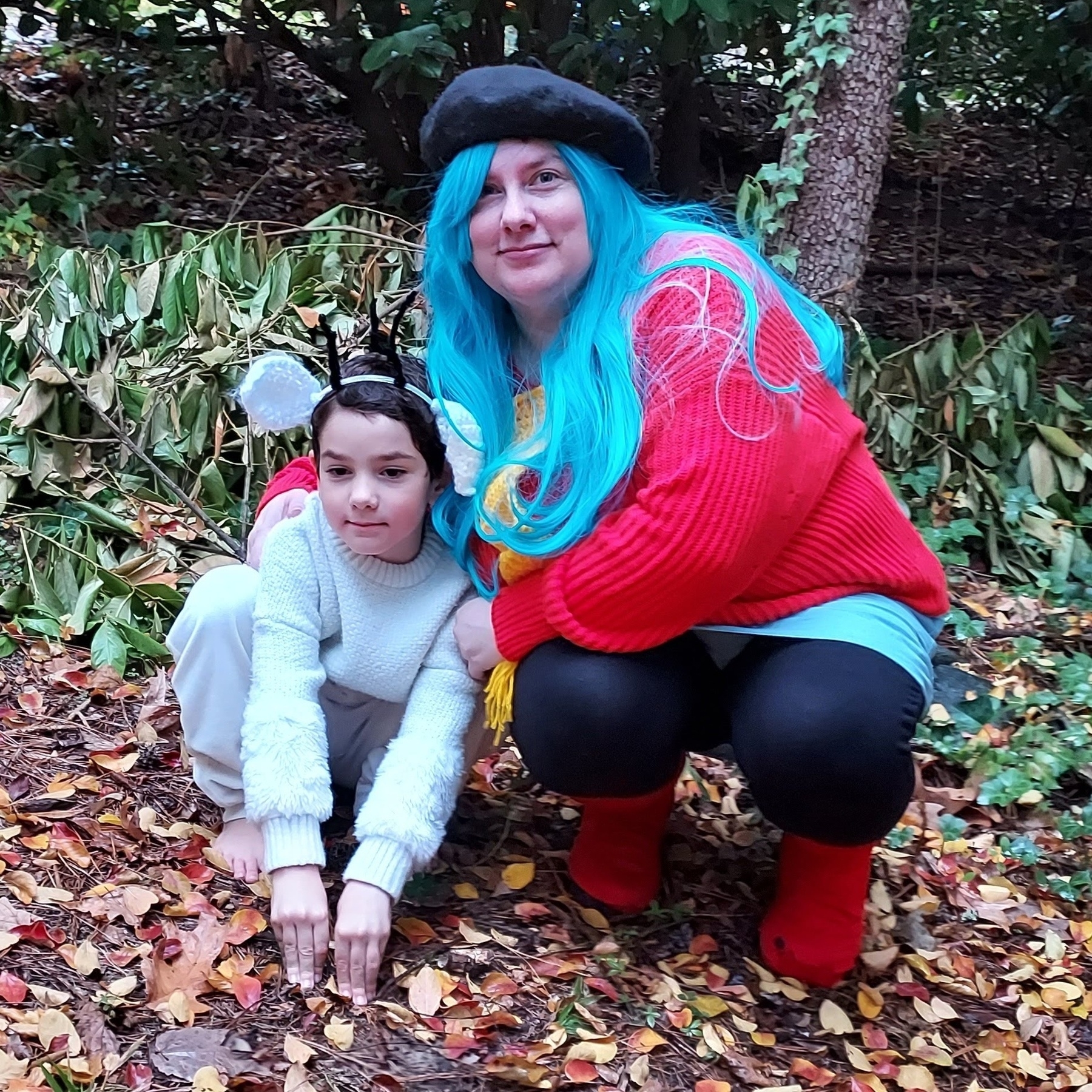 A child dressed as Twig the Deerfox and an adult dressed as Hilda, both from the Hildafolk graphic novels and Hilda Netflix series