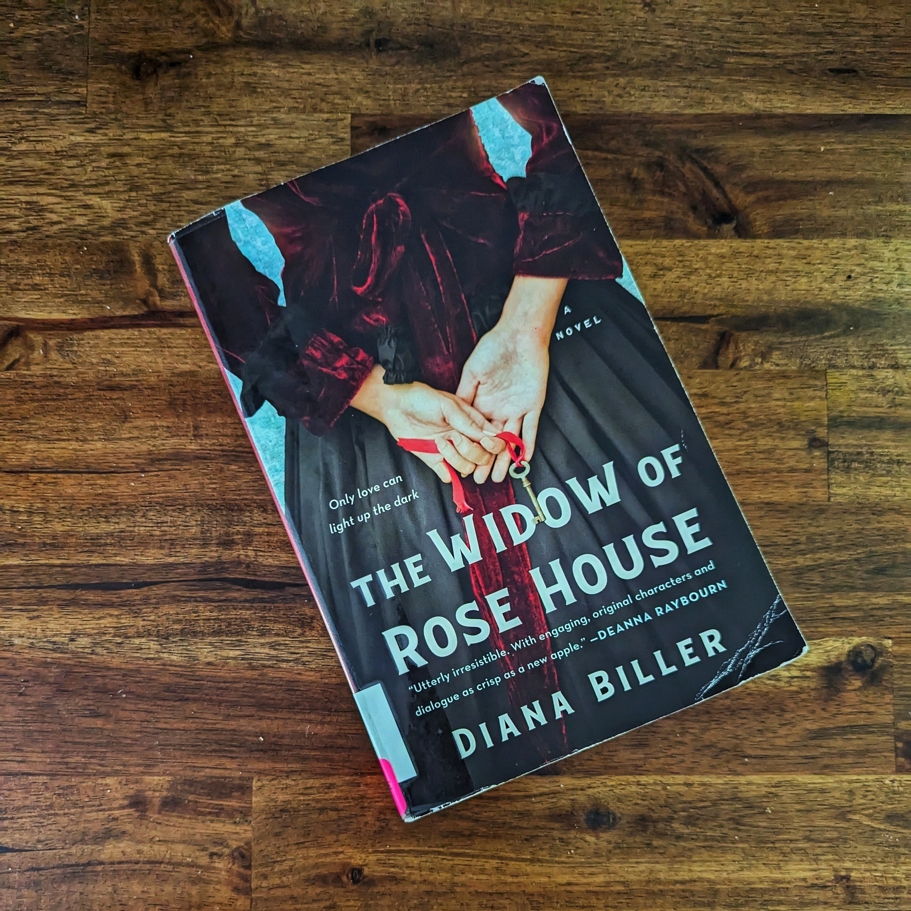 The cover of the novel The Widow of Rose House