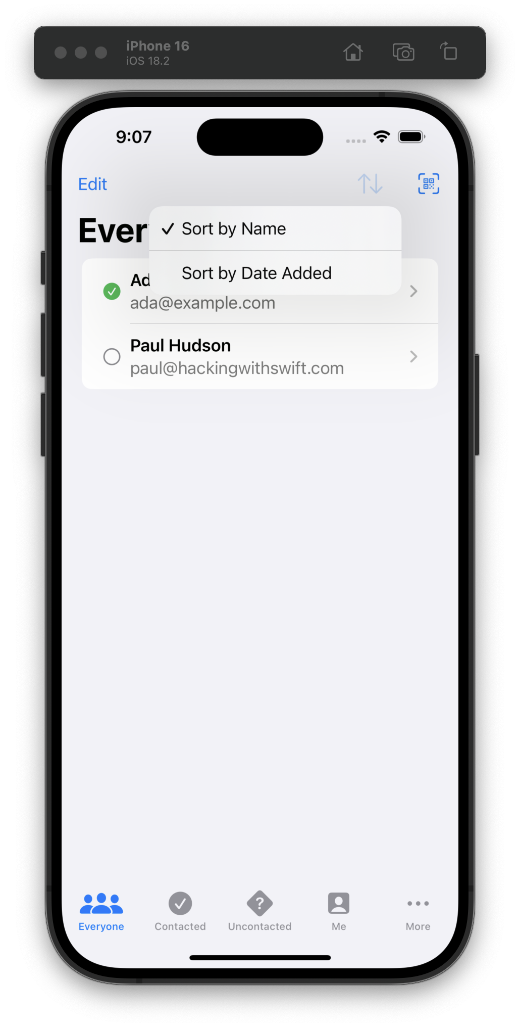 The iOS Simulator displays an app with the title Everyone at the top . A sorting menu is open, offering options to sort by name or date added. Sort by Name is selected, shown with a checkmark. Below the menu, two contacts are listed: Ada with the email ada@example.com and Paul Hudson with the email paul@hackingwithswift.com. The bottom navigation bar includes five tabs: Everyone, Contacted, Uncontacted, Me, and More, with Everyone currently selected.