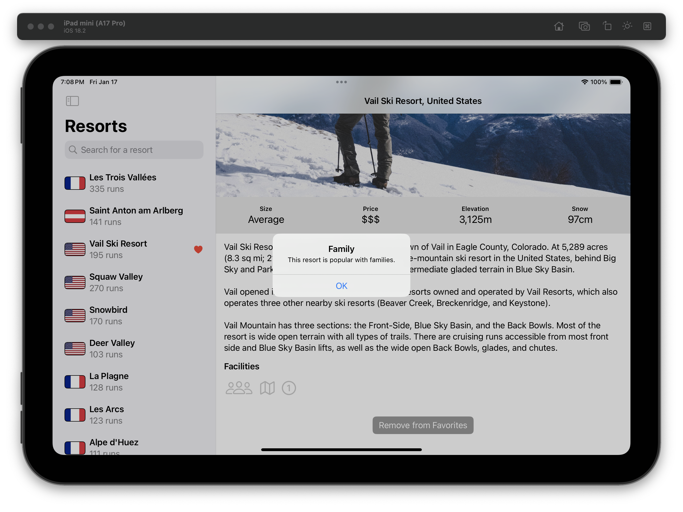 The iOS Simulator displays an iPad with a “Resorts” app open in split view. The left pane lists resorts, and “Vail Ski Resort” is selected with a heart icon. The right detail view shows the resort’s information. A modal alert labeled “Family” overlays the entire screen and says, “This resort is popular with families” with an OK button.