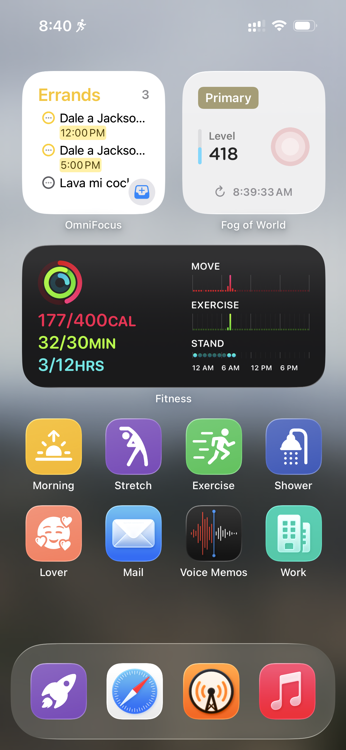 An iOS home screen (in Small icon mode with labels under the icons) showing a blurred outdoor background. The first row has OmniFocus and Fog of World widgets. The second row has a Fitness widget. The third row has Morning, Stretch, Exercise, and Shower shortcuts. The fourth row has Lover, Mail, Voice Memos, and Work shortcuts. The dock at the bottom has a personal shortcuts launcher, Safari, Overcast, and Music.