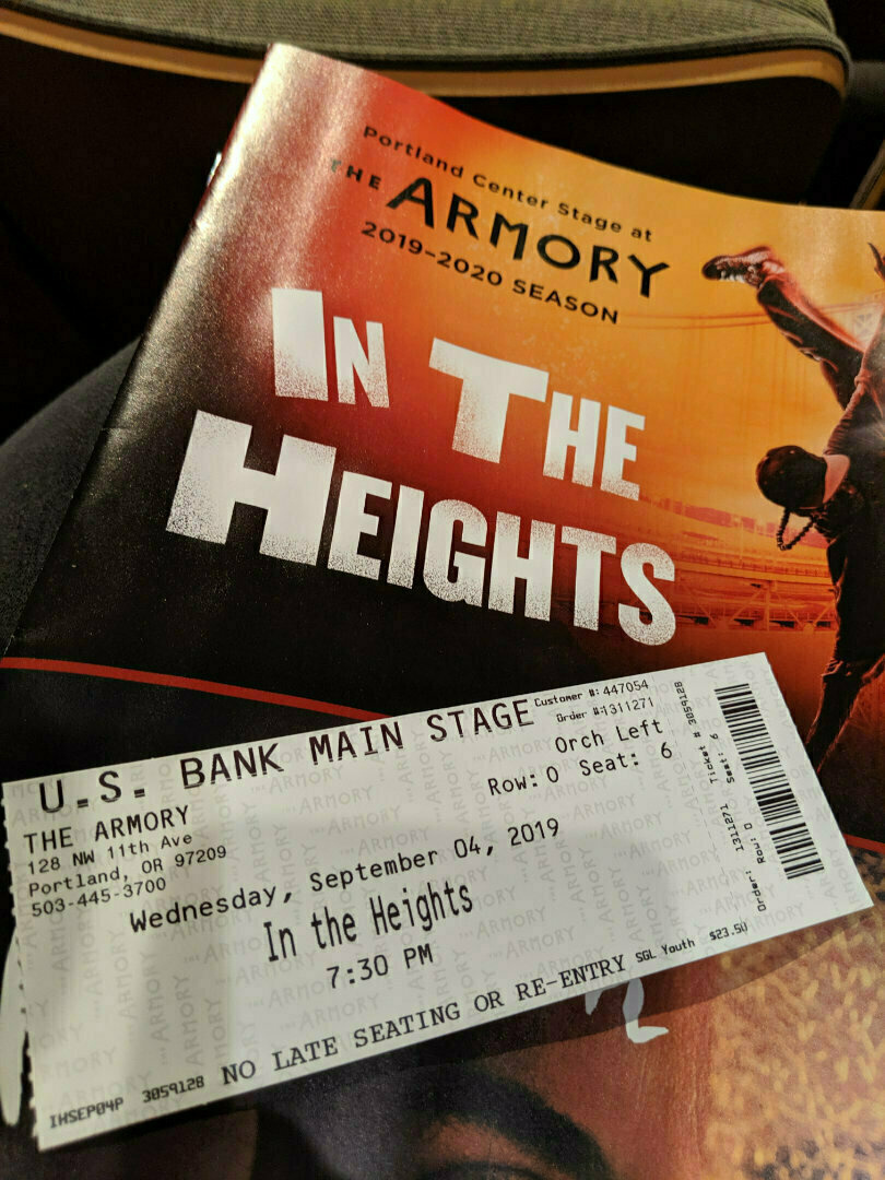 A program and ticket for a performance of In the Heights at the Portland Center Stage are shown.
