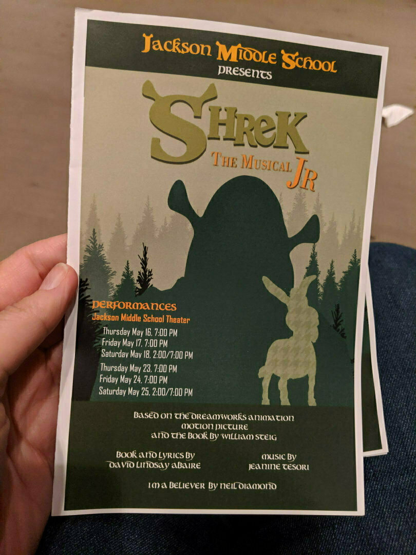 A poster for Shrek The Musical Jr. by Jackson Middle School, listing performance dates and credits.
