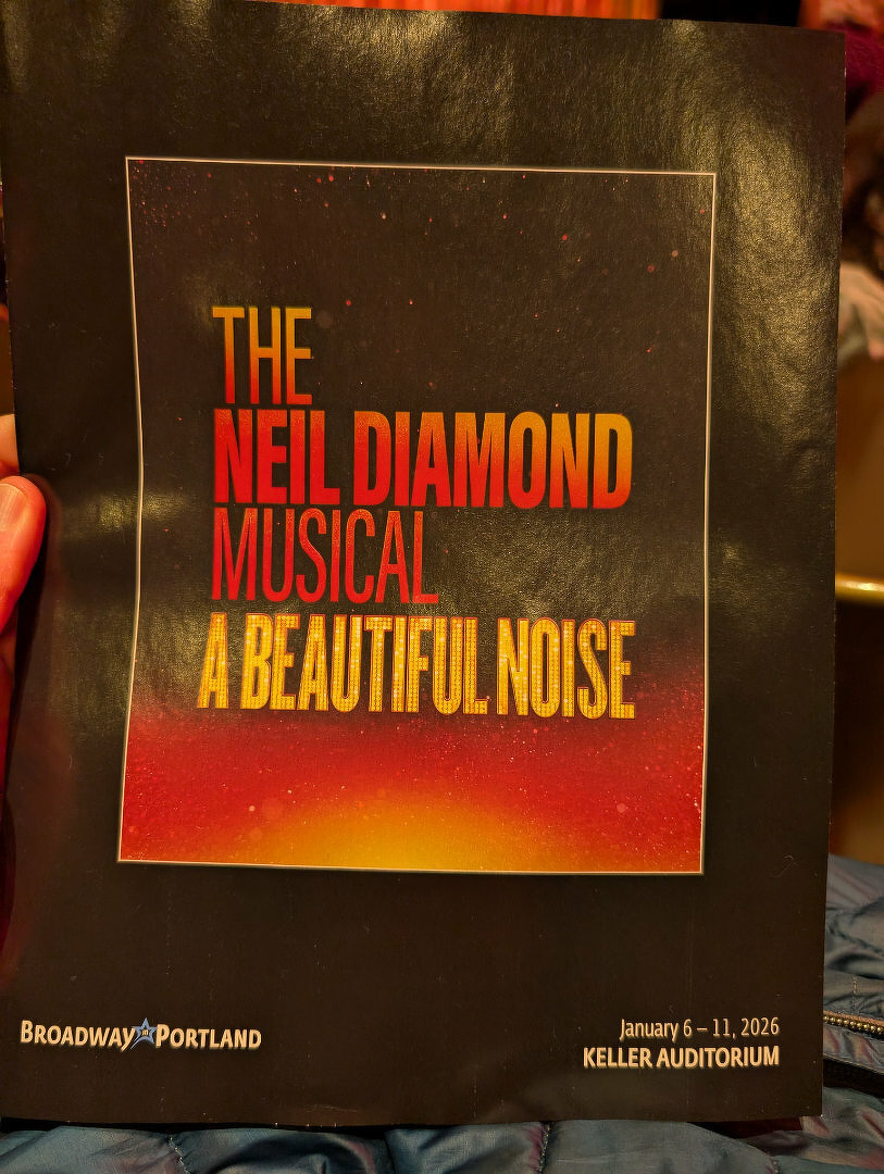 A program for The Neil Diamond Musical: A Beautiful Noise is being held, with details about its run at the Keller Auditorium from January 6-11, 2026.
