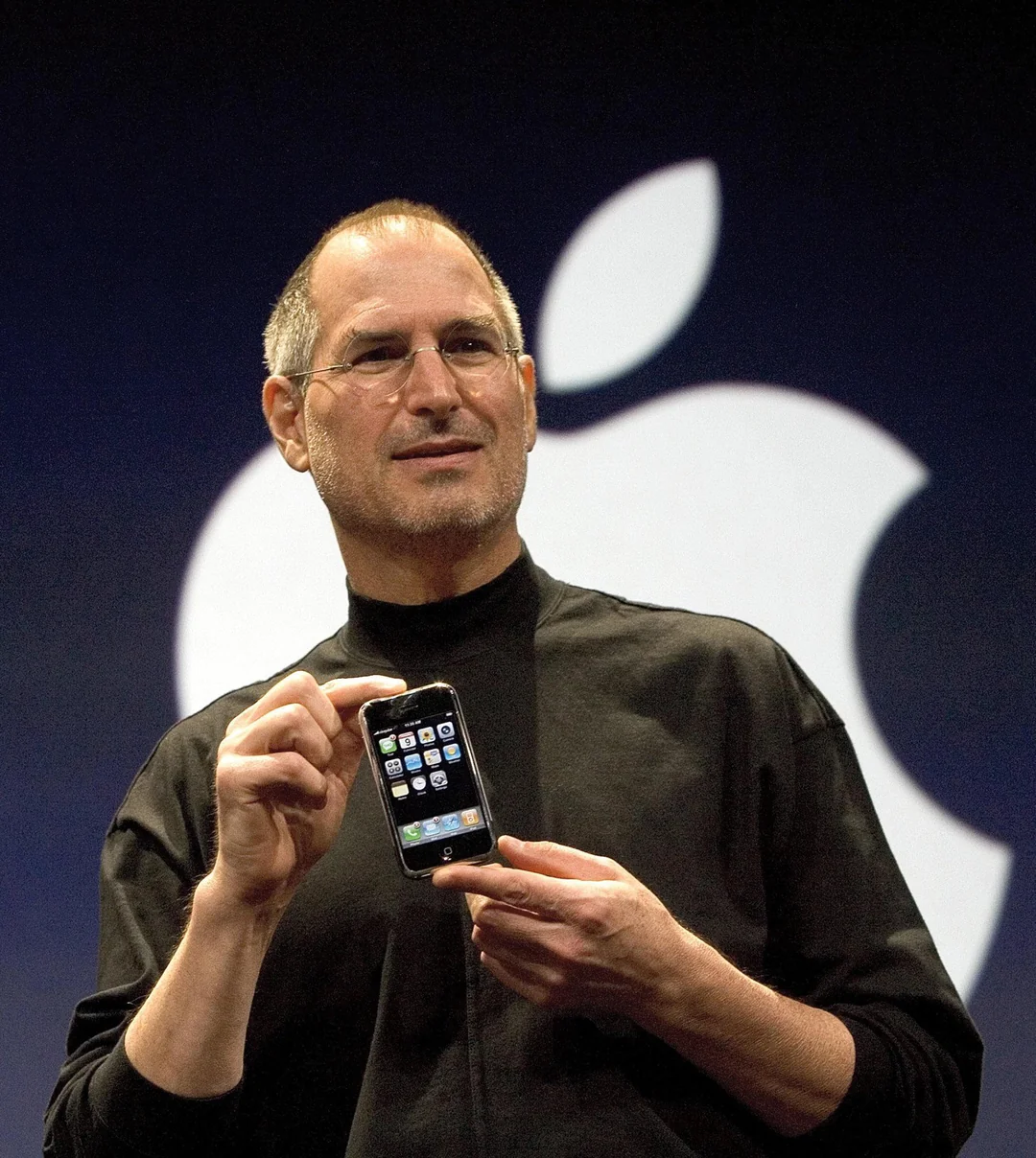 Steve Jobs holding the first iPhone 18 years ago yesterday Jan 9th