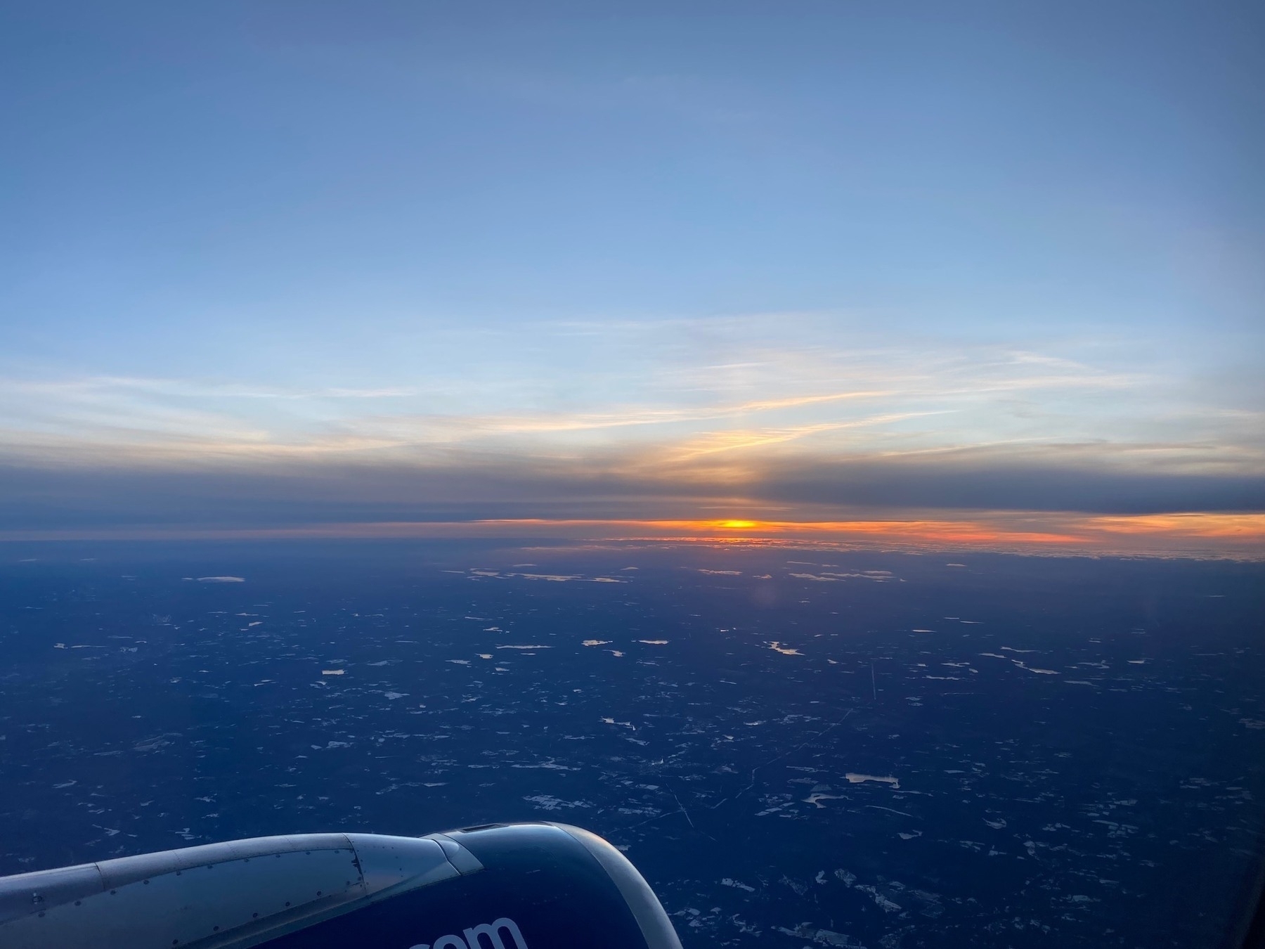 View of a sunset from a plane window.