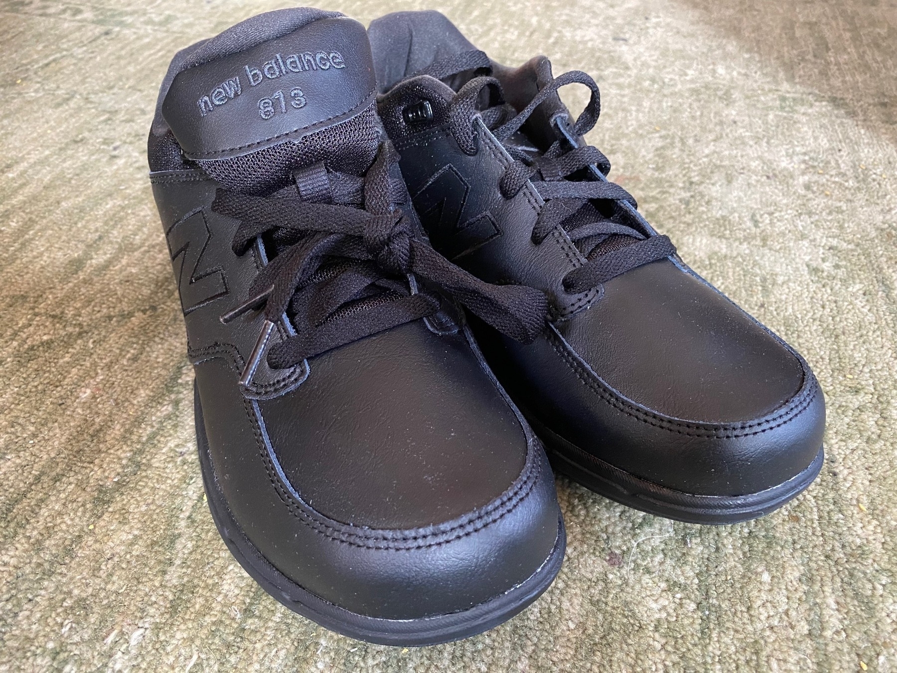 Pair of brand new black walking shoes.